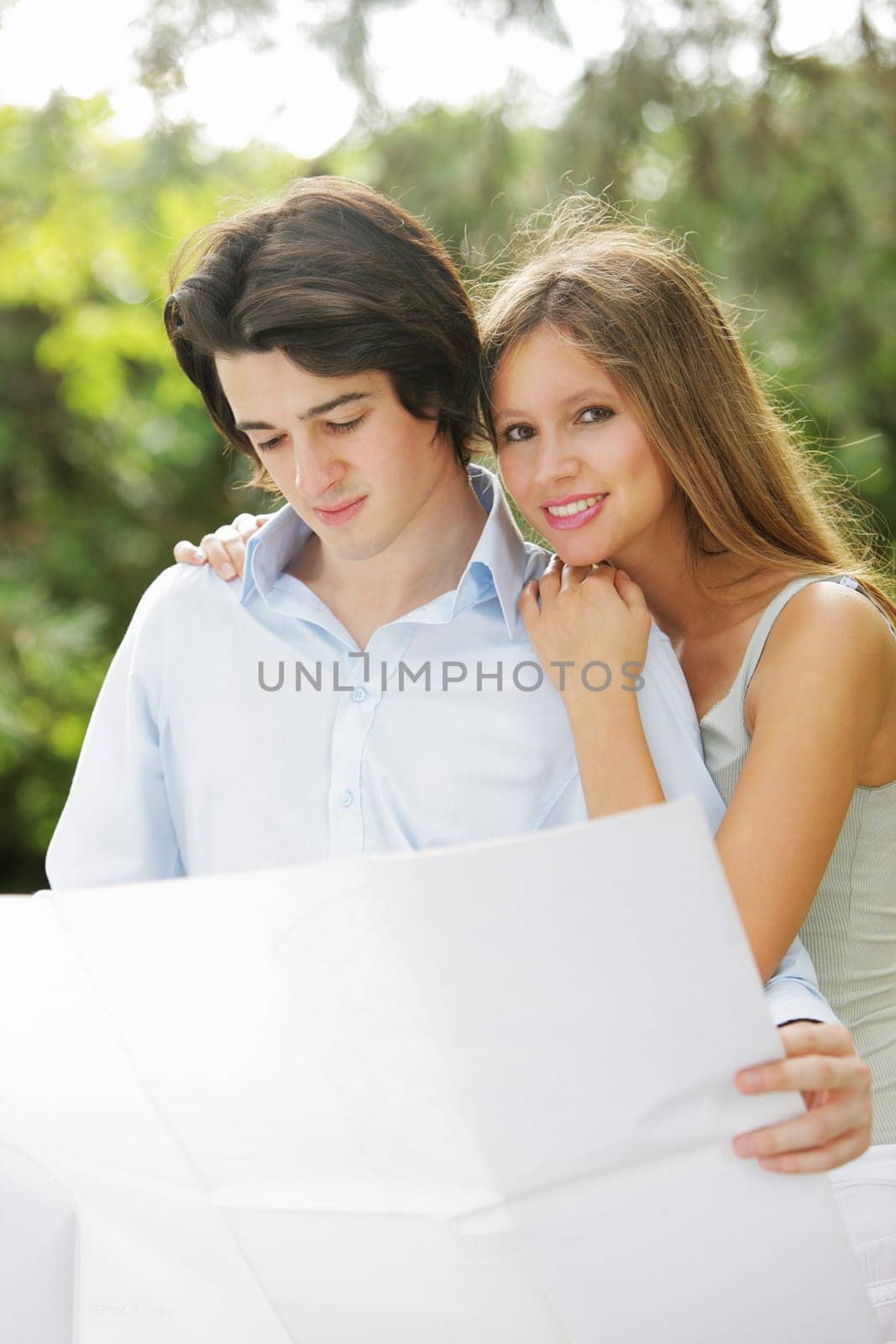 a young married couple examines the design of its new home