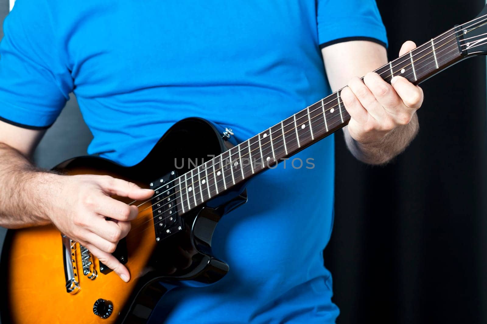 Man exercising on guitar