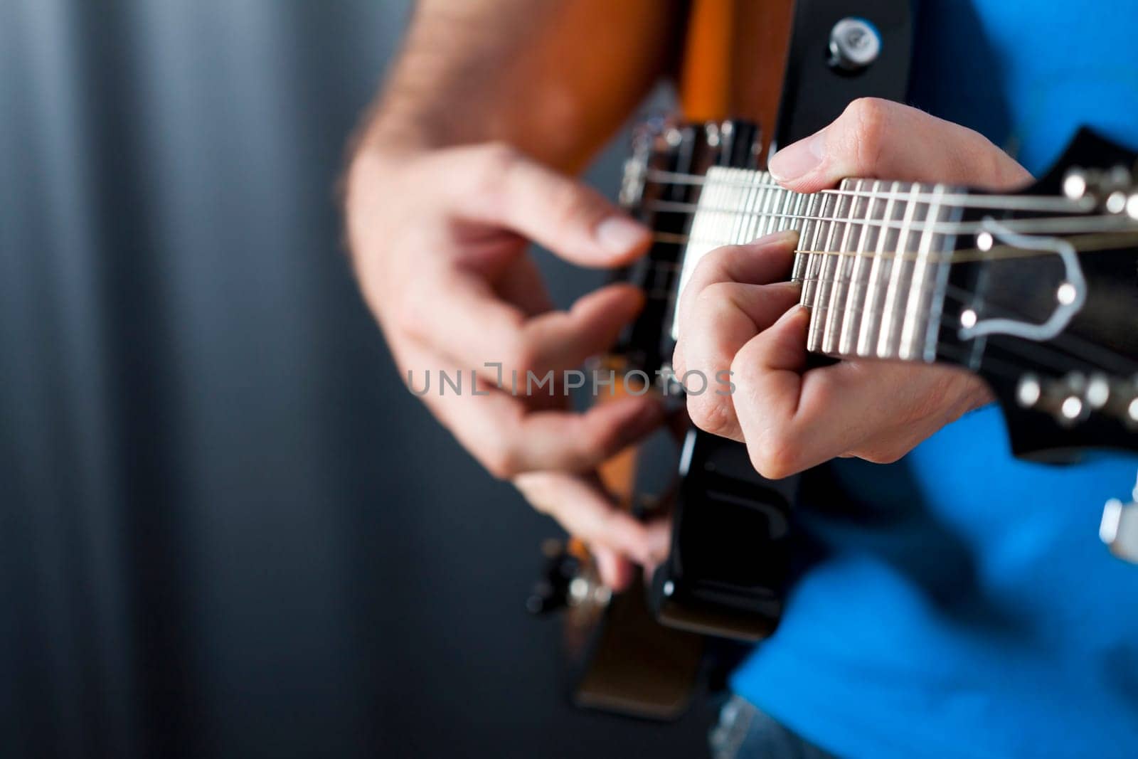 Man exercising on guitar