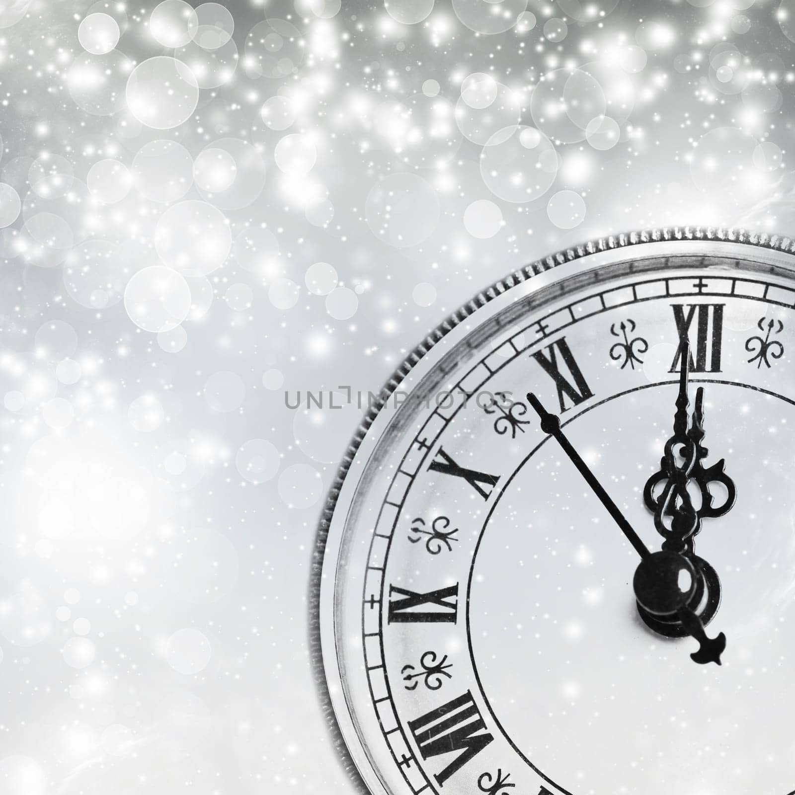 Old clock against holiday lights