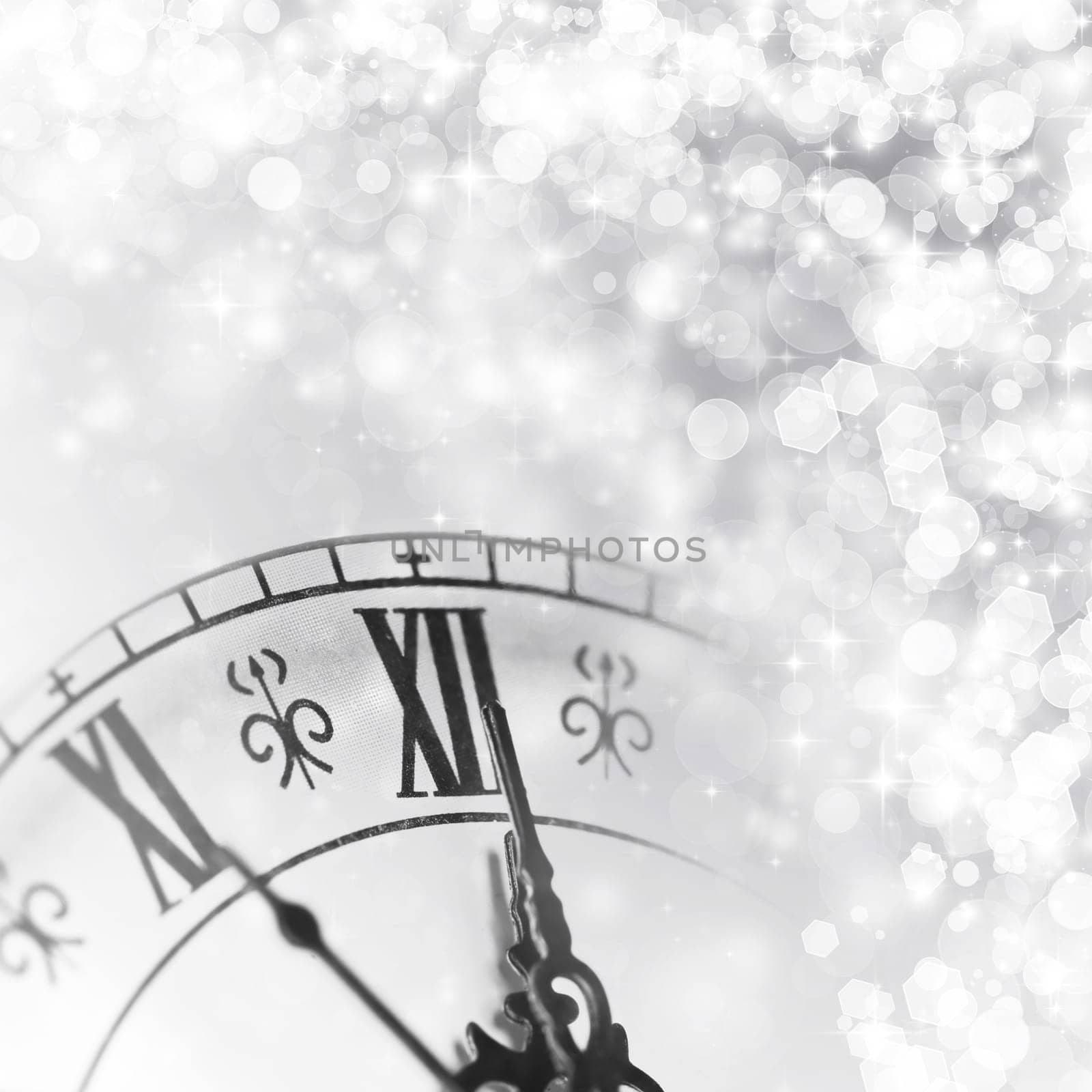Old clock against holiday lights