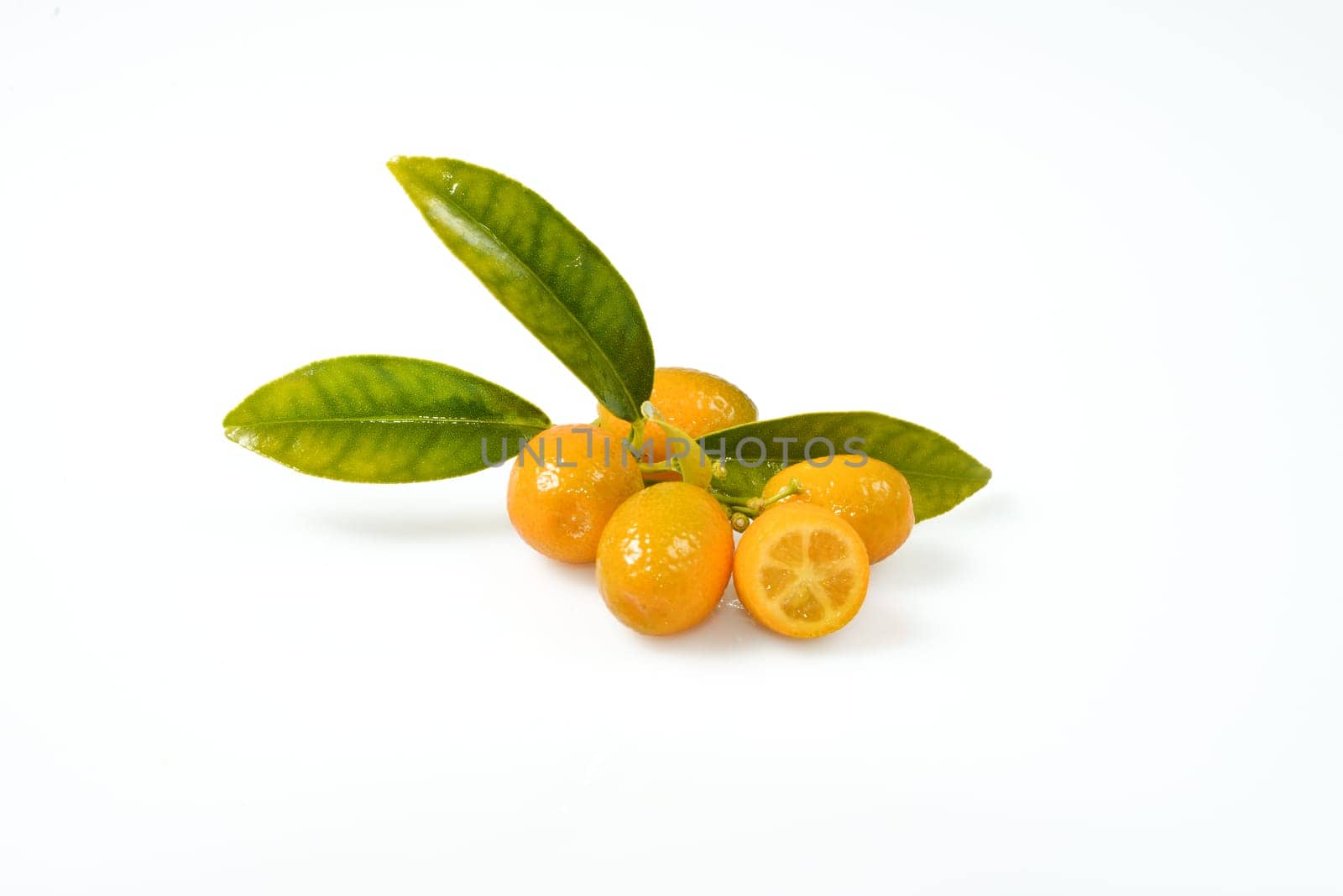 ripe orange cut in slices on a white background