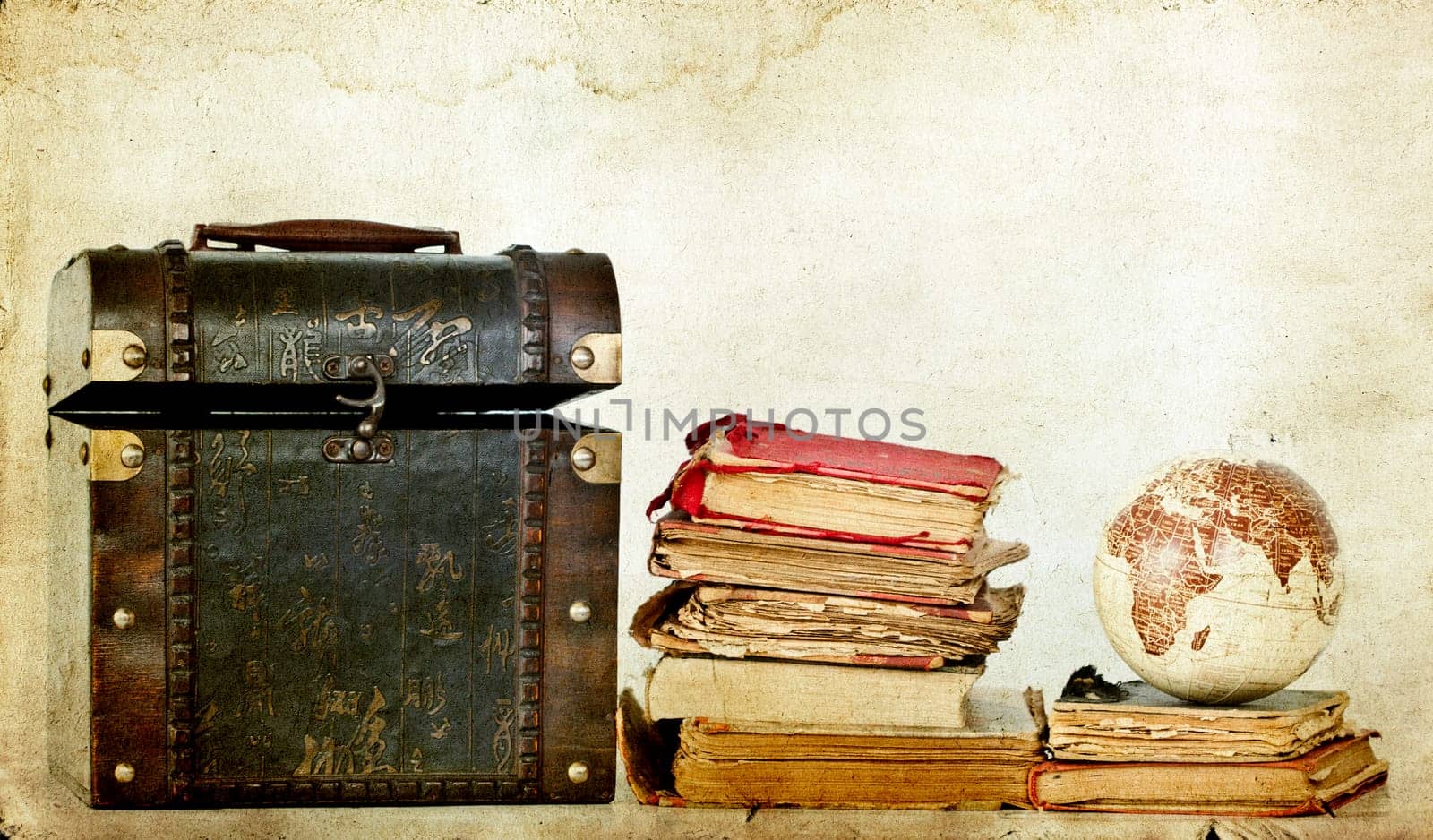 Vintage photo of old books, treasure box and Earth globe