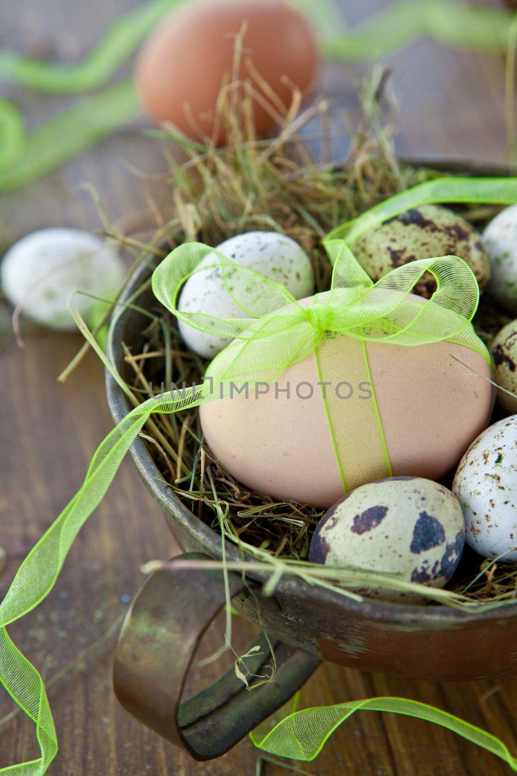 Various raw eggs in Easter basket