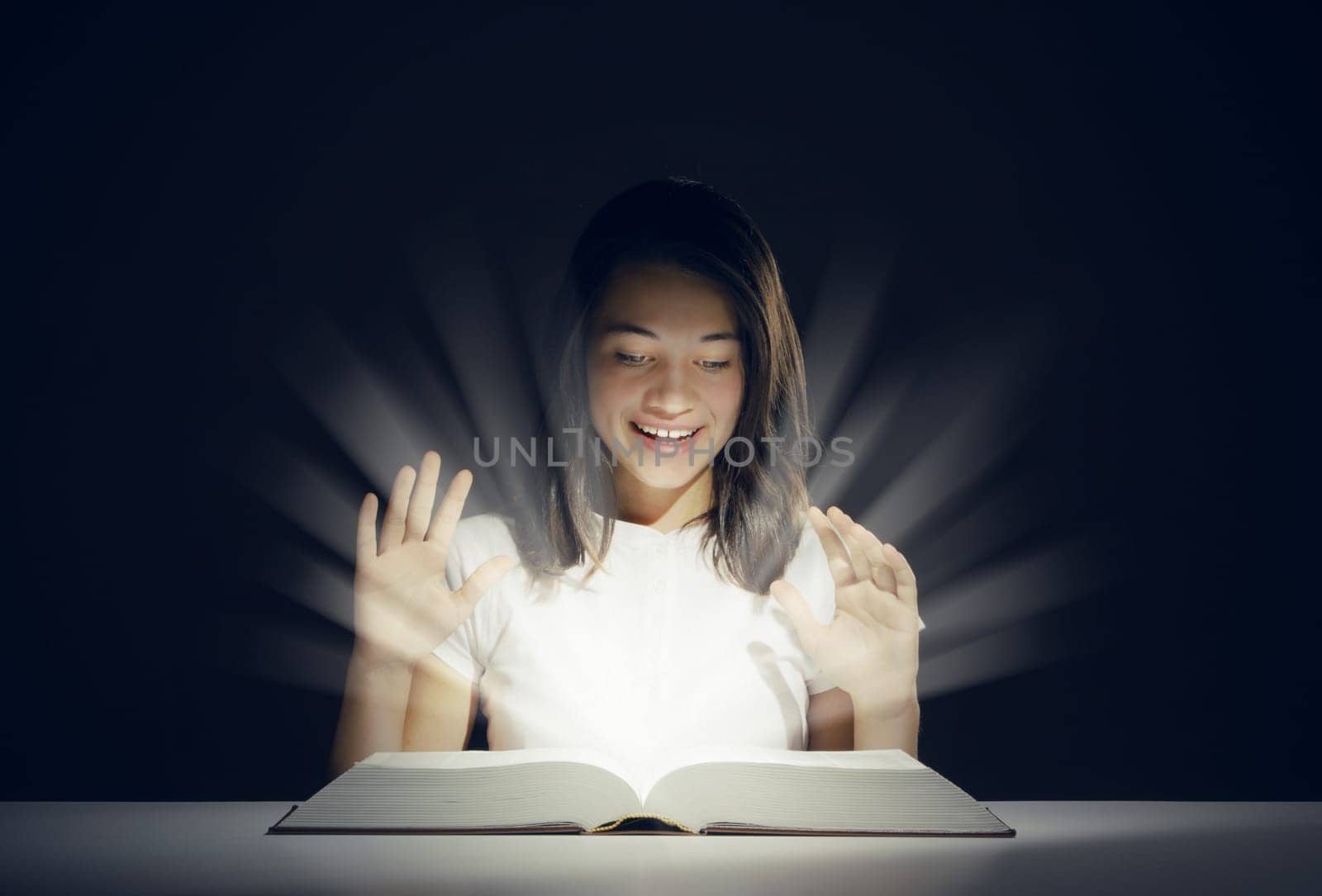 Young girl open a magic book