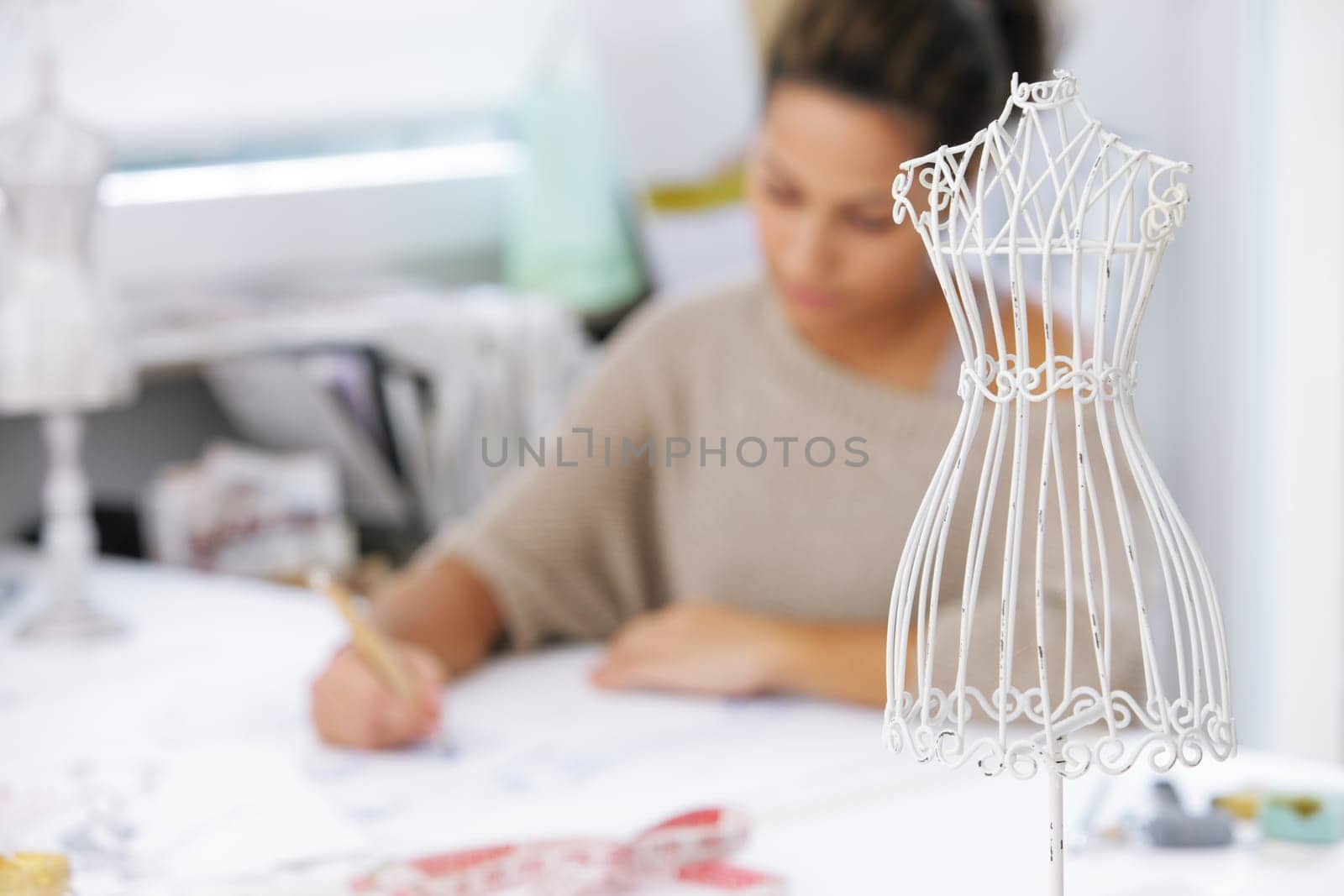 Fashion designer is drawing a fashion model