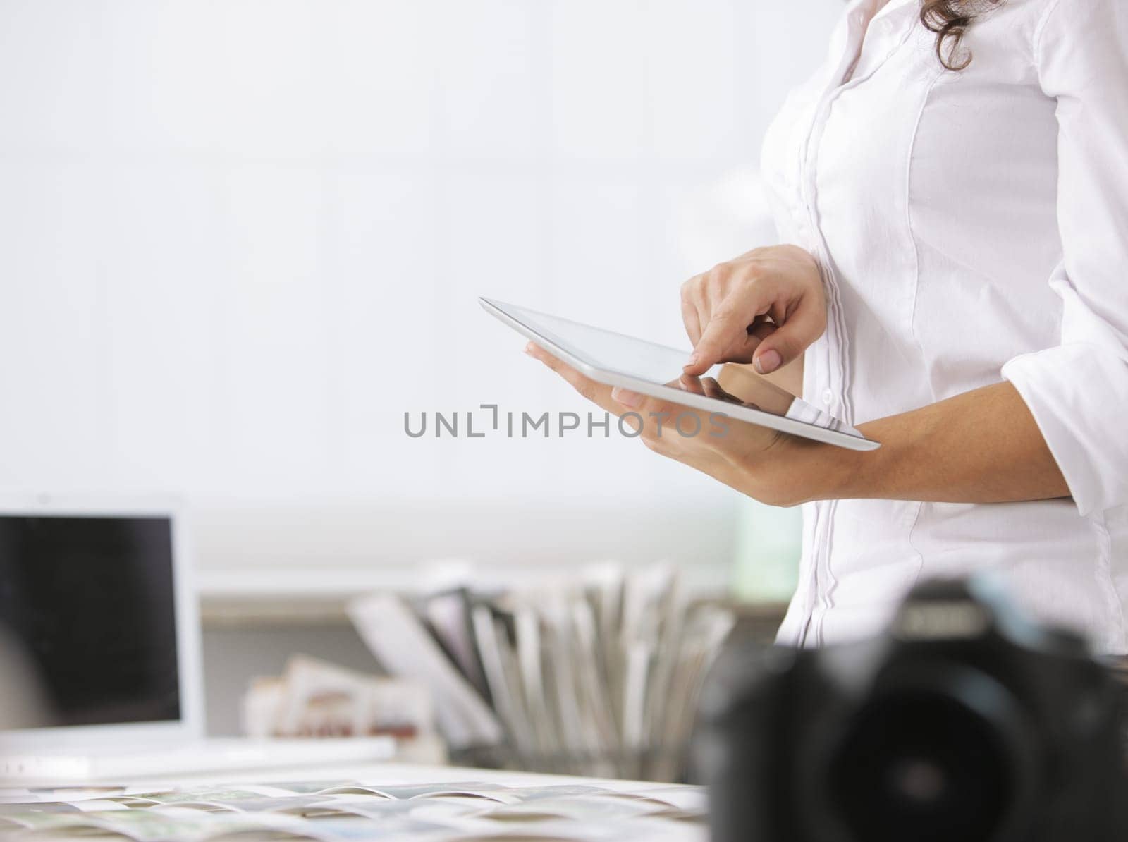 young photographer using his digital tablet, hand close up
