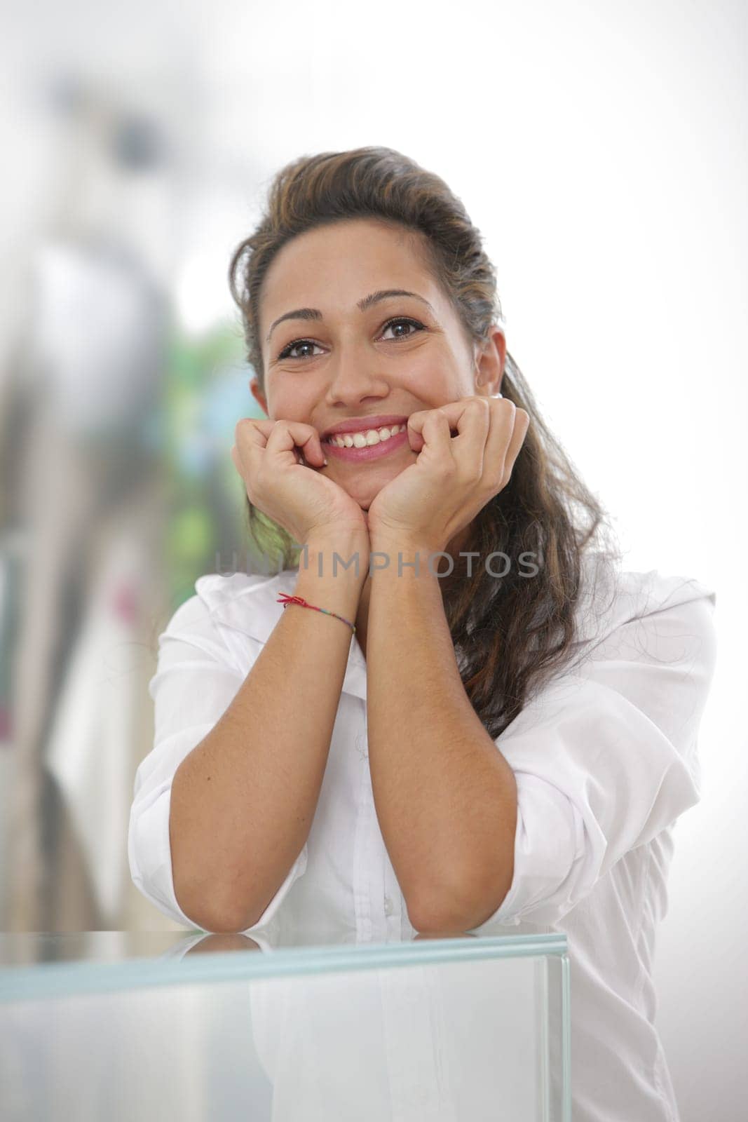 Young brunette businesswoman smiling at the camera