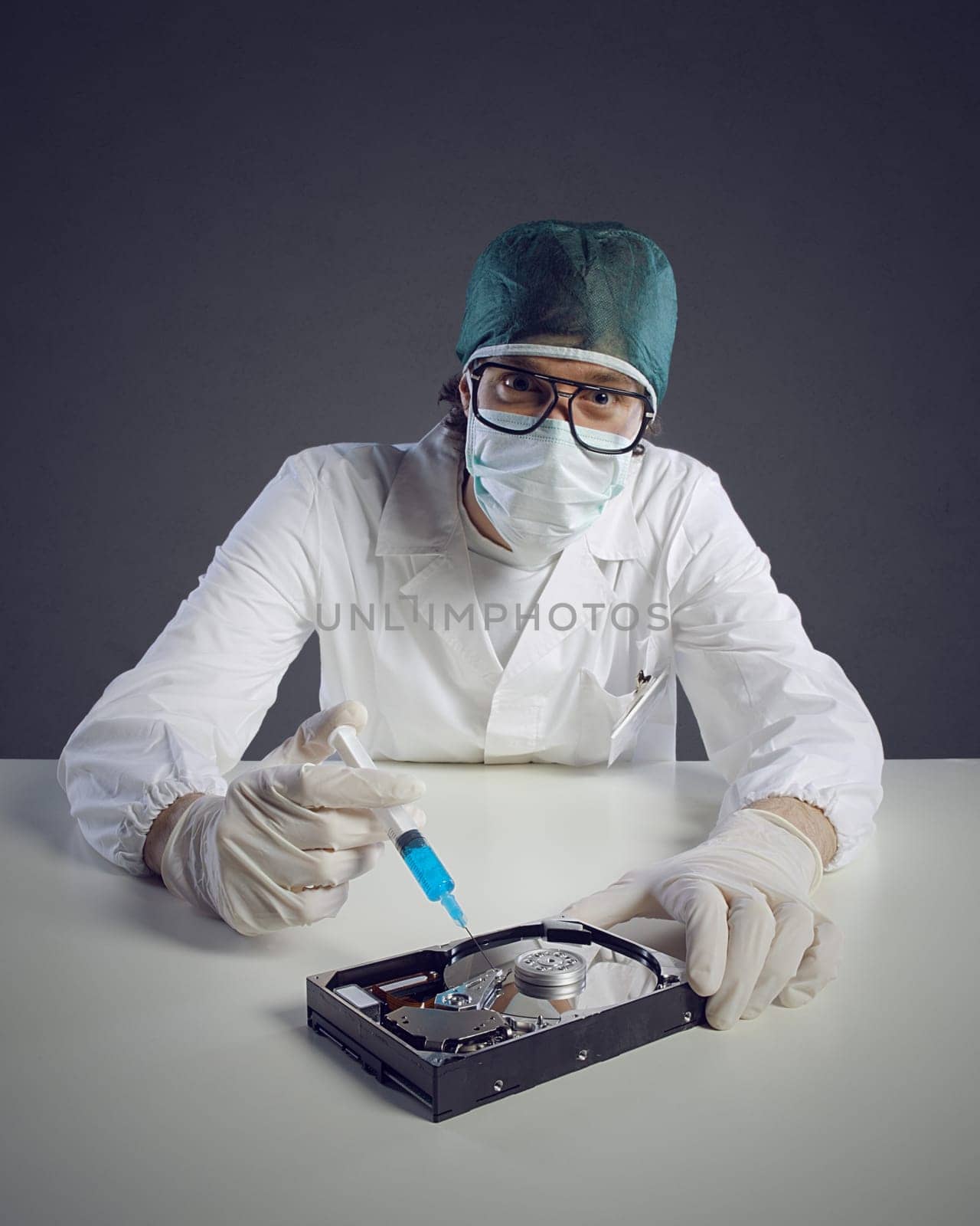 Computer virus concept. Technical / Doctor with syringe and hard disk