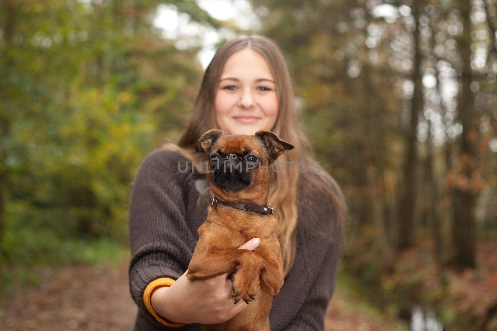 Young teenage girl is having a nice time in the cold november