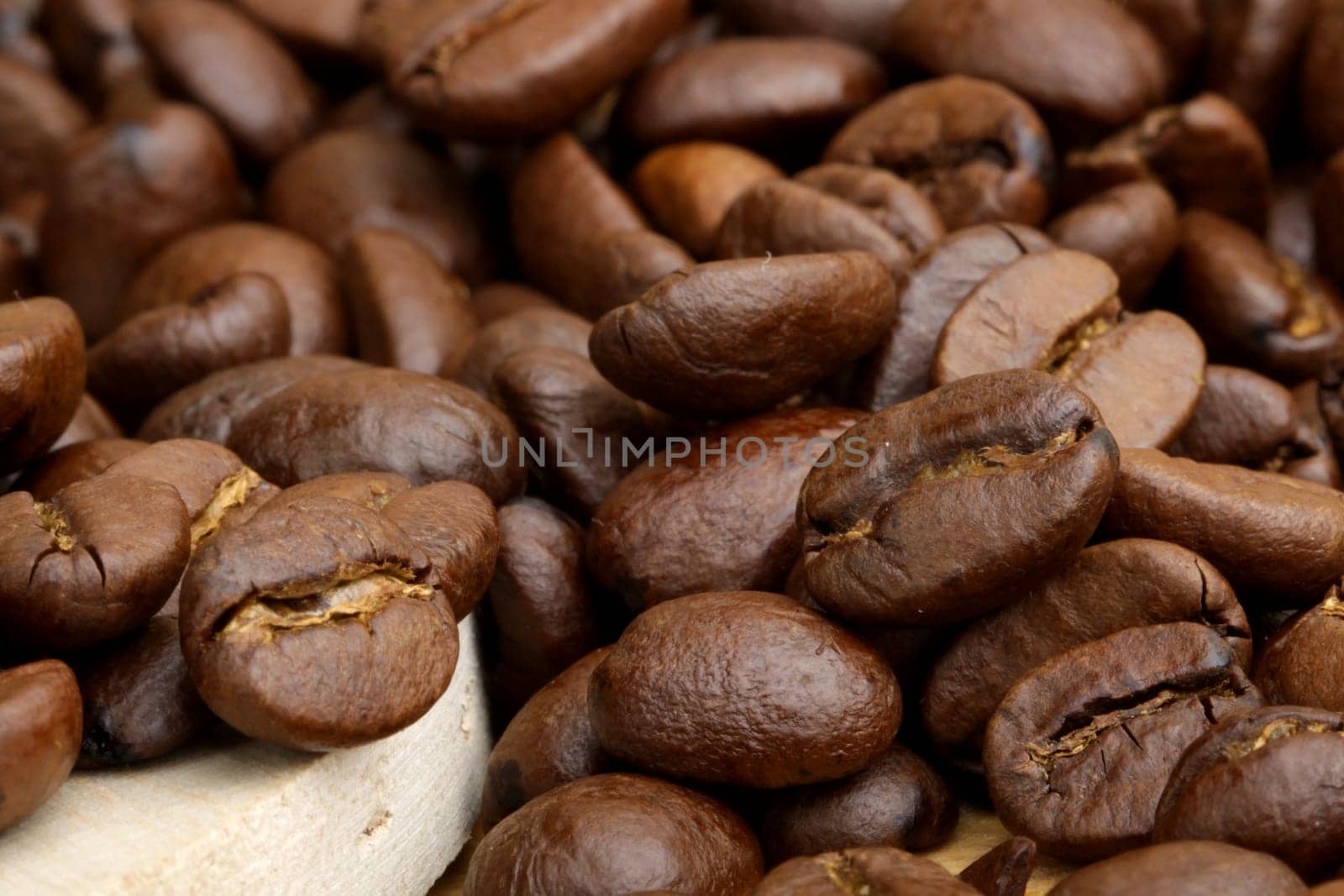 scattered grains of black roasted coffee