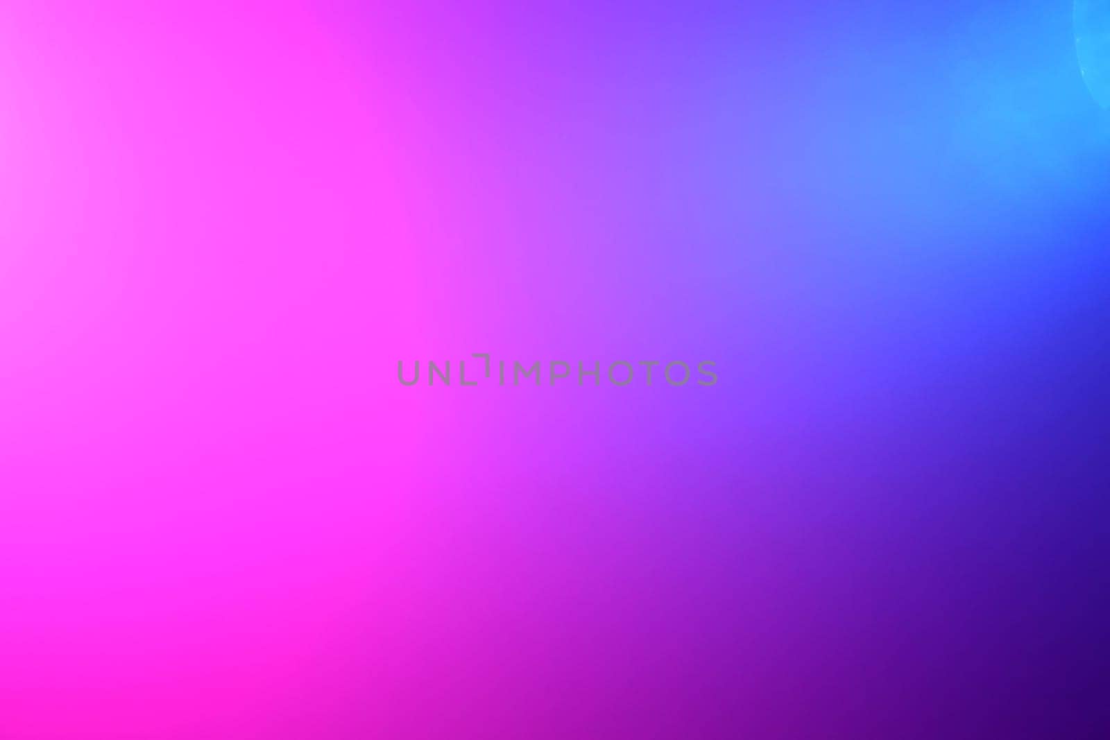 Background of pink and blue color lights shining through fog