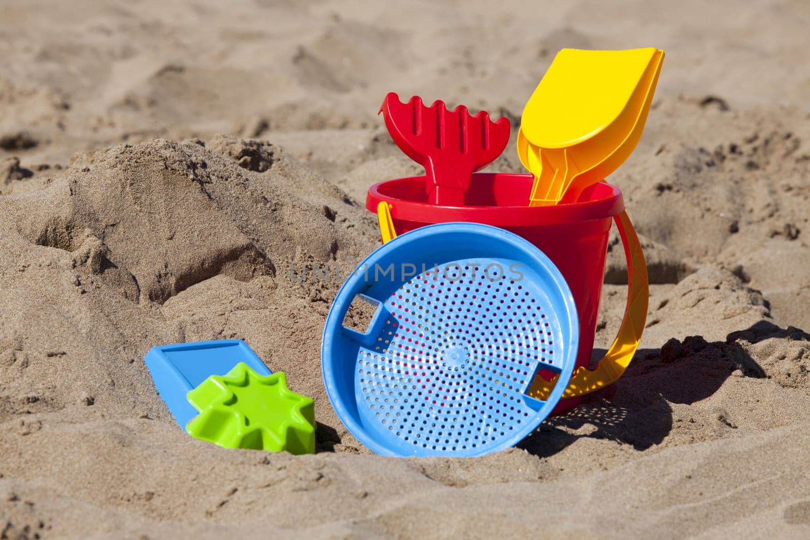 Close-up of beach toy in the sand