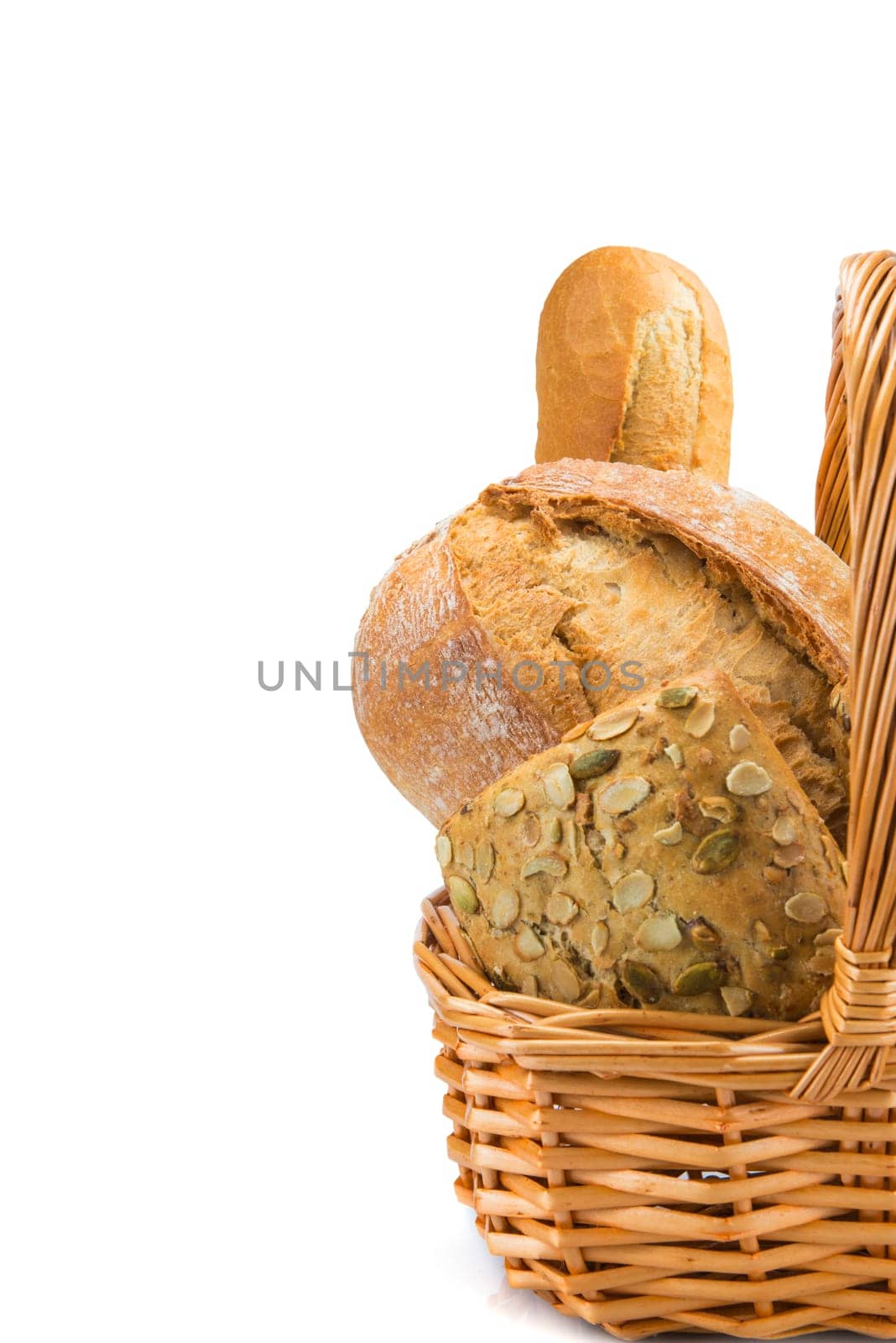 Still life about a basket with a large bread assortment isolated over a white background