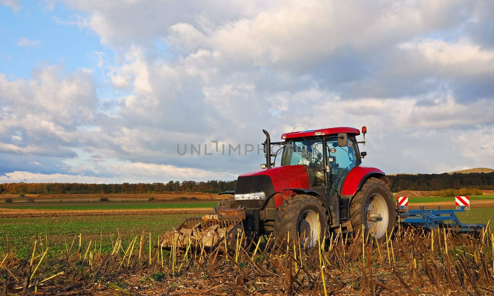 Tractor in the field ploughing
