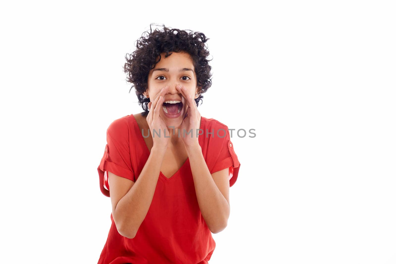 Portrait of happy hispanic woman screaming and shouting at camera