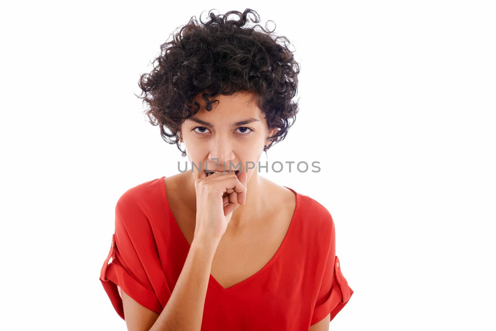 hispanic frustrated woman biting fingers, angry, looking at camera