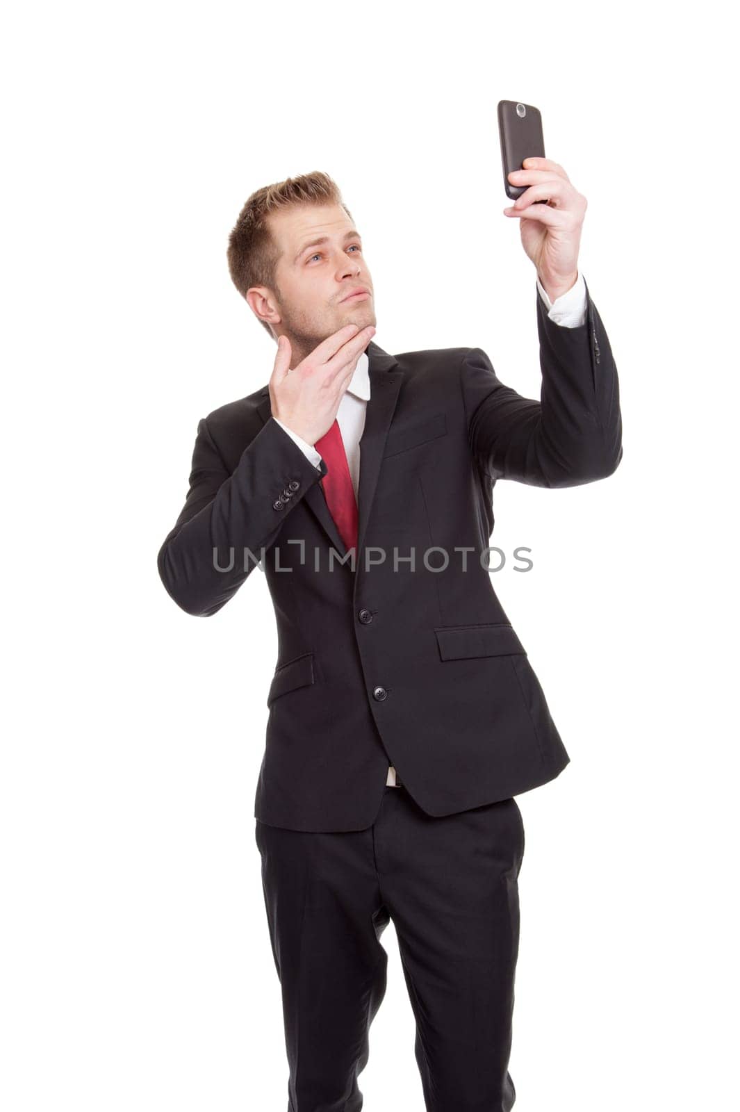 Handsome businessman taking a selfie with a mobile phone