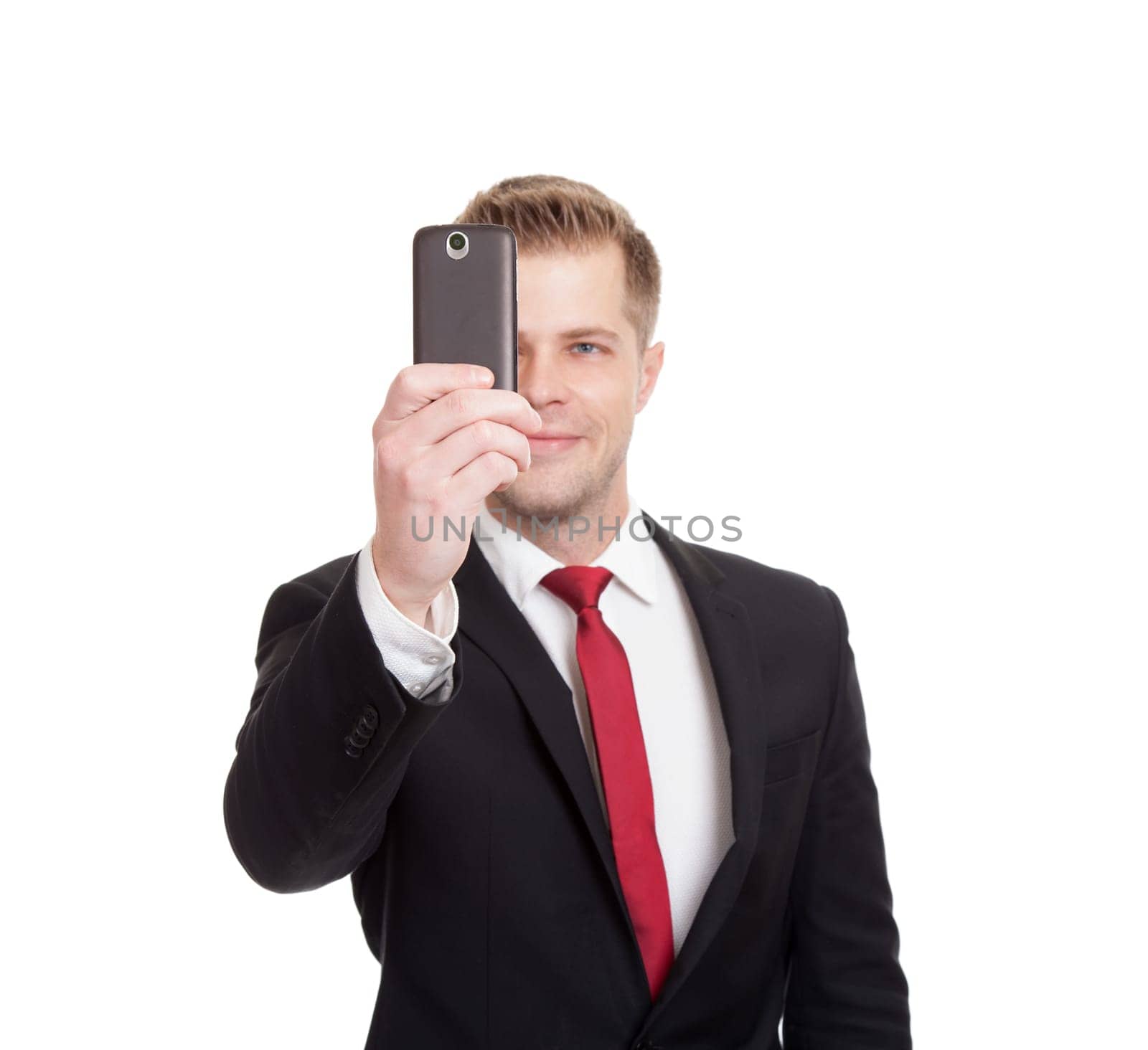 Handsome businessman taking a selfie with a mobile phone