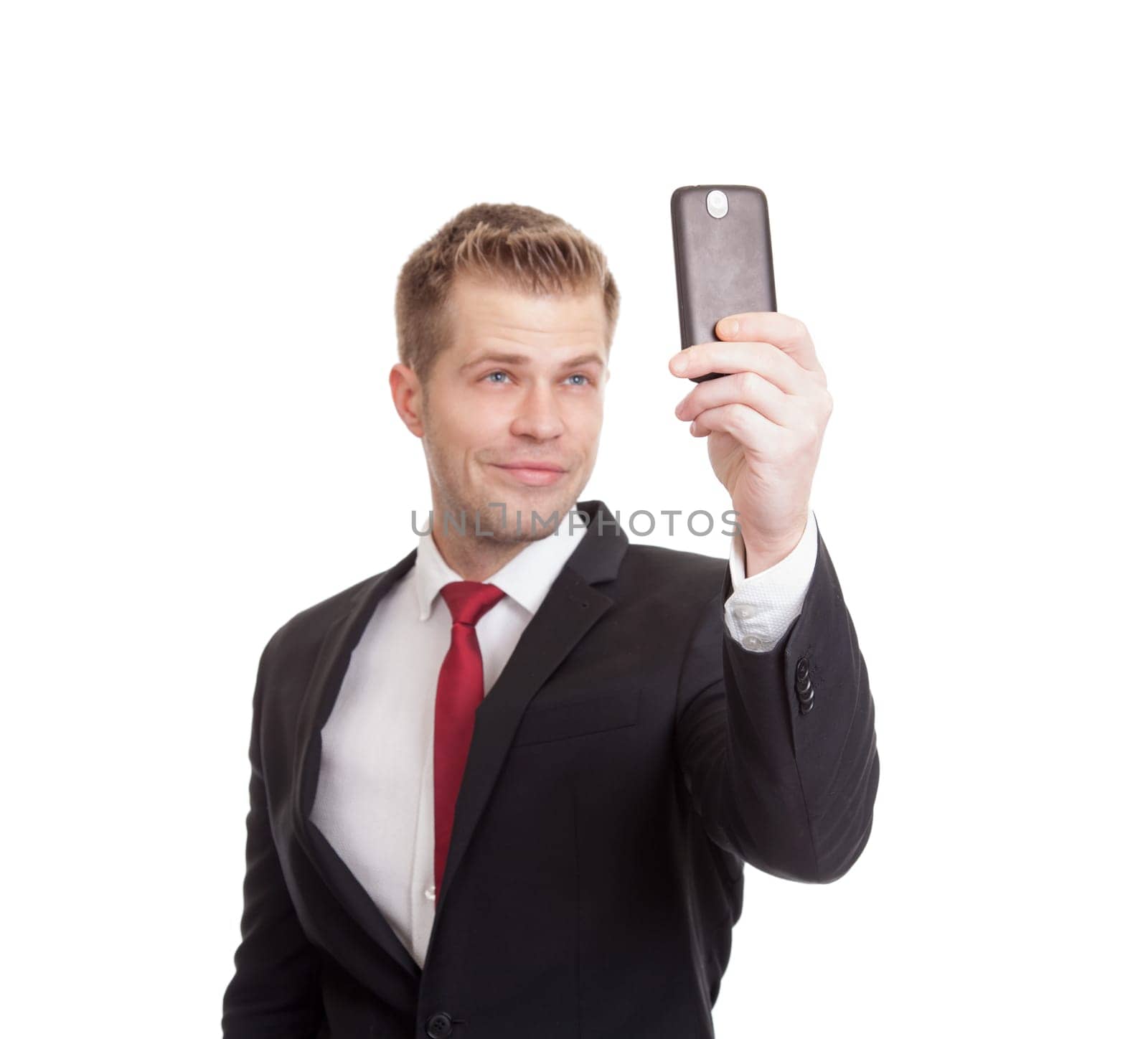 Handsome businessman taking a selfie with a mobile phone