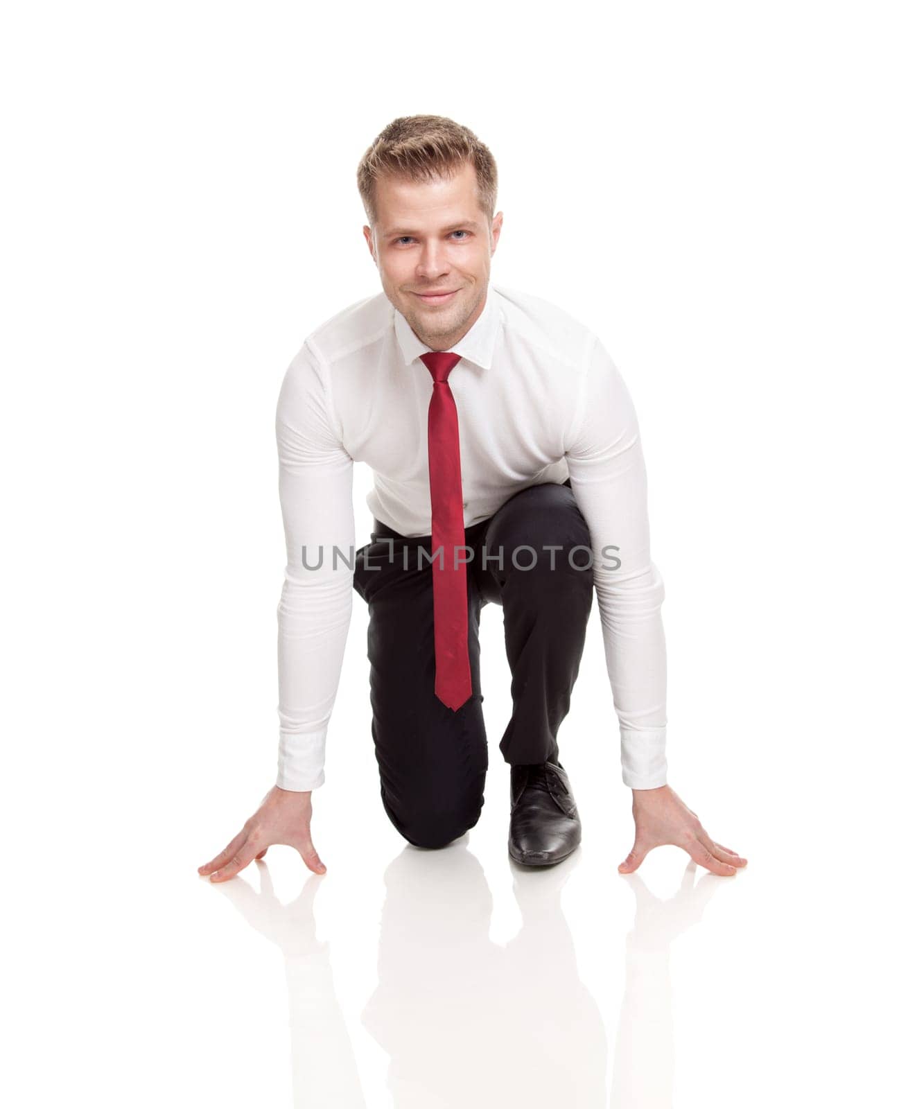 Businessman in starting position ready for chasing deals