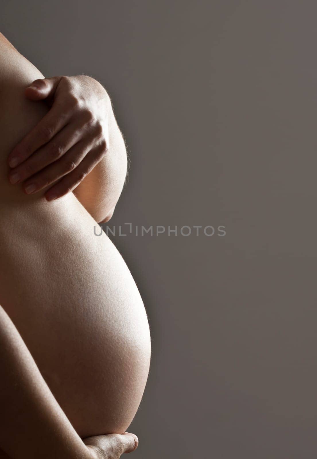 Belly of a nine month pregnant woman