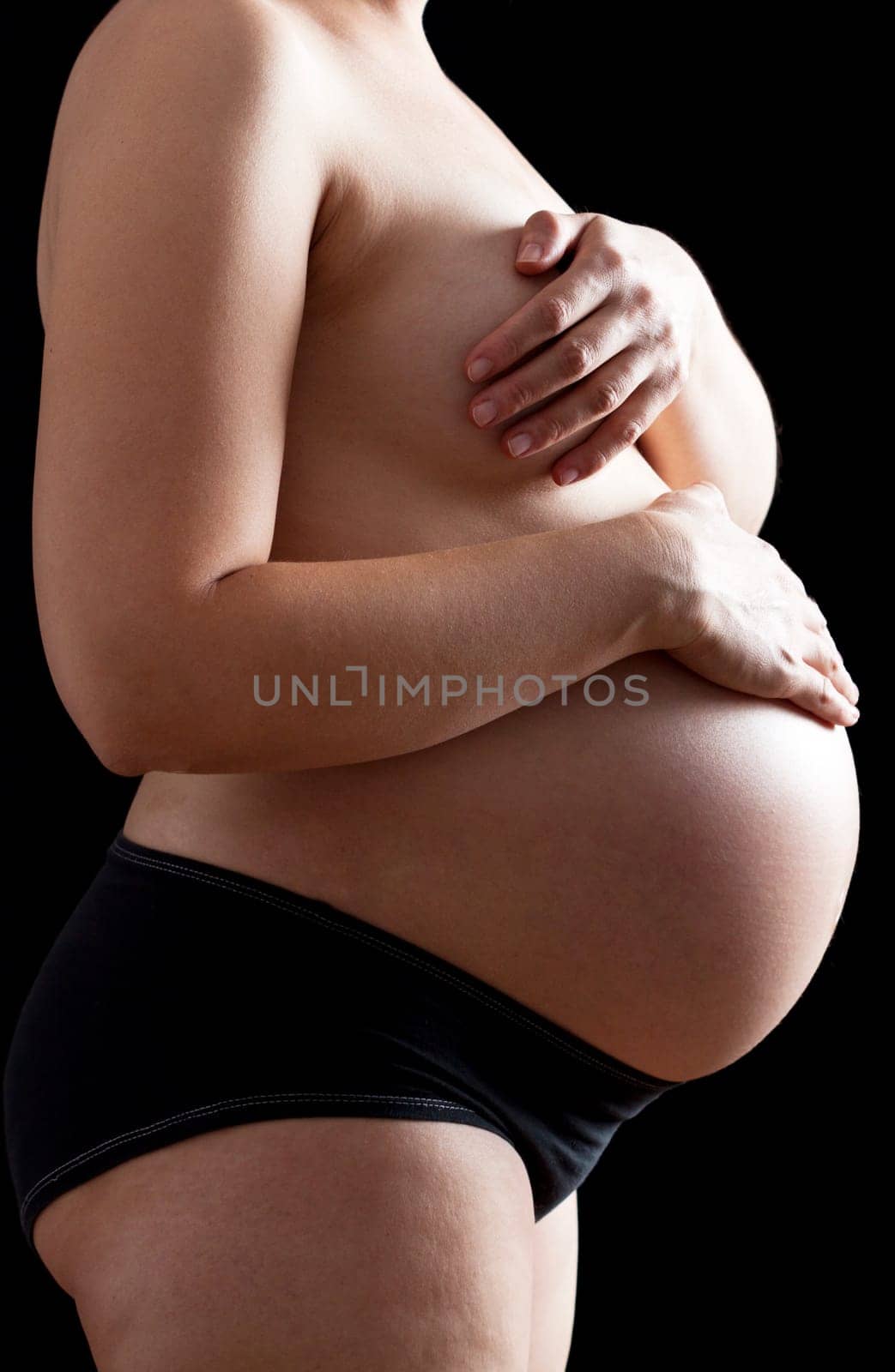 Belly of a nine month pregnant woman