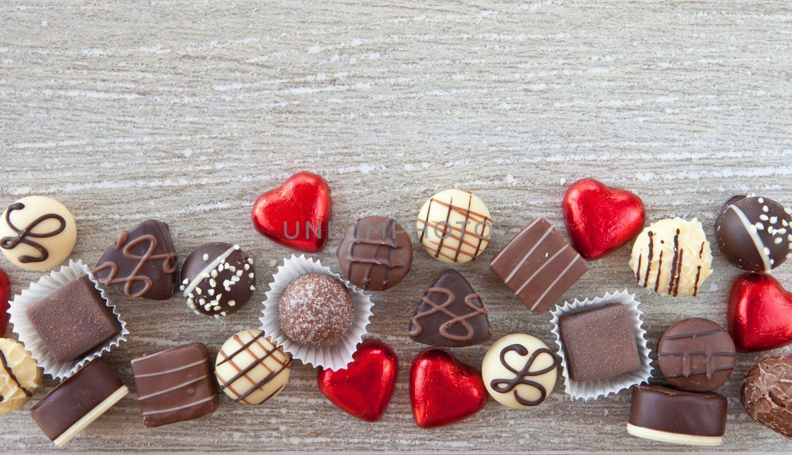 Various chocolates and chocolates on a gray background