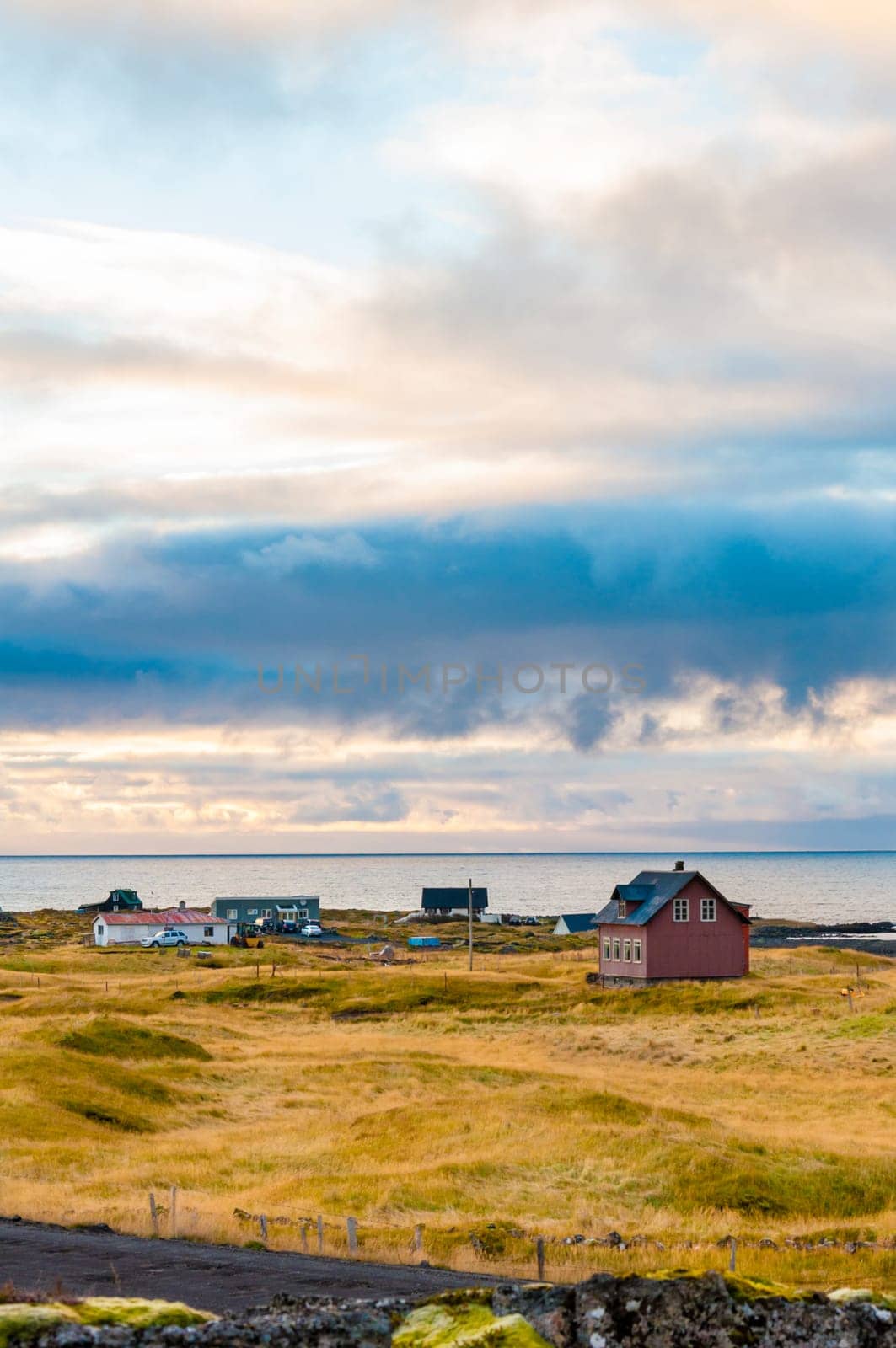Icelandic landscape with volcanic rocks and green grass