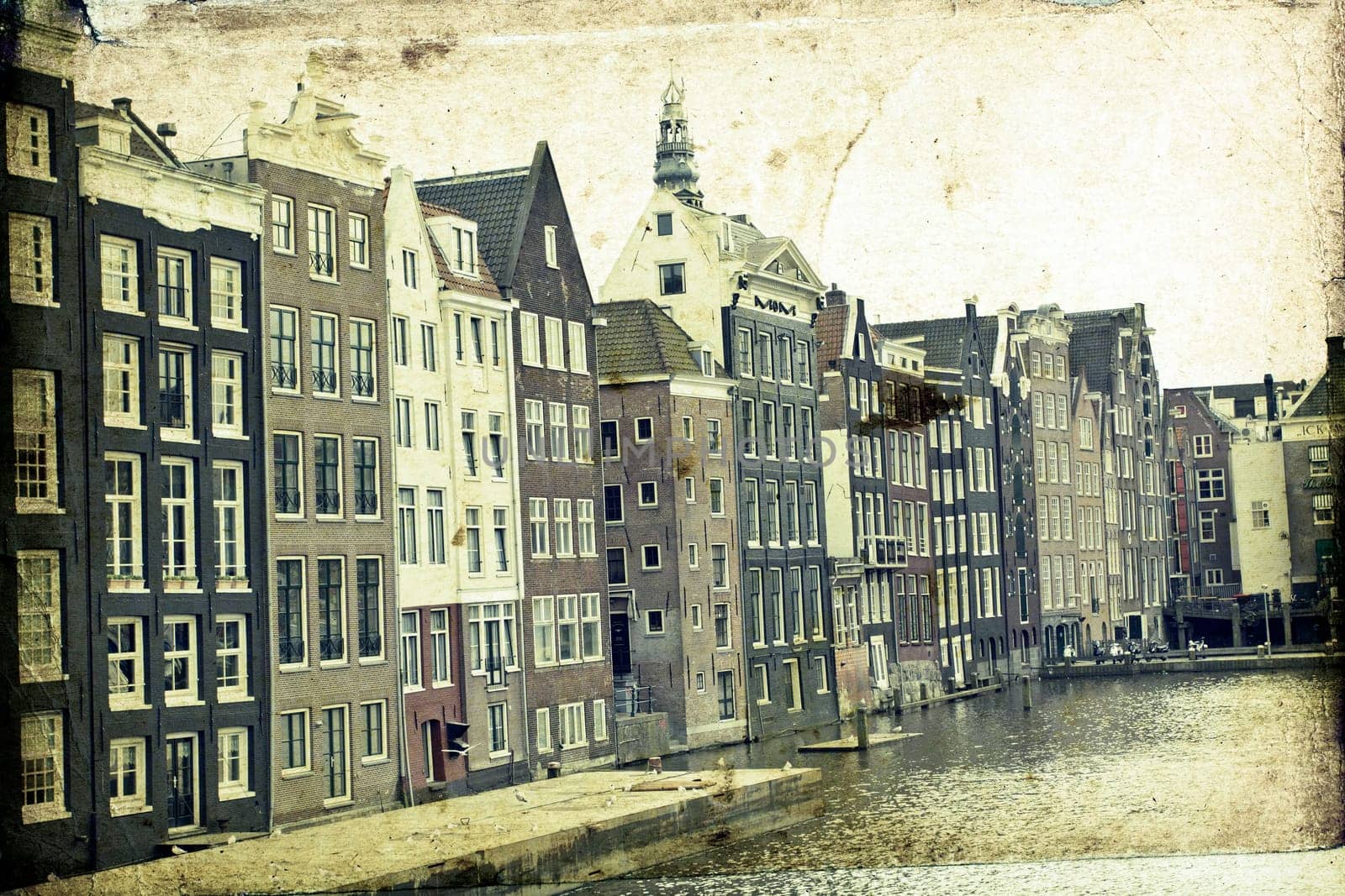 Vintage photo of traditional dutch buildings and canal, in city of Amsterdam