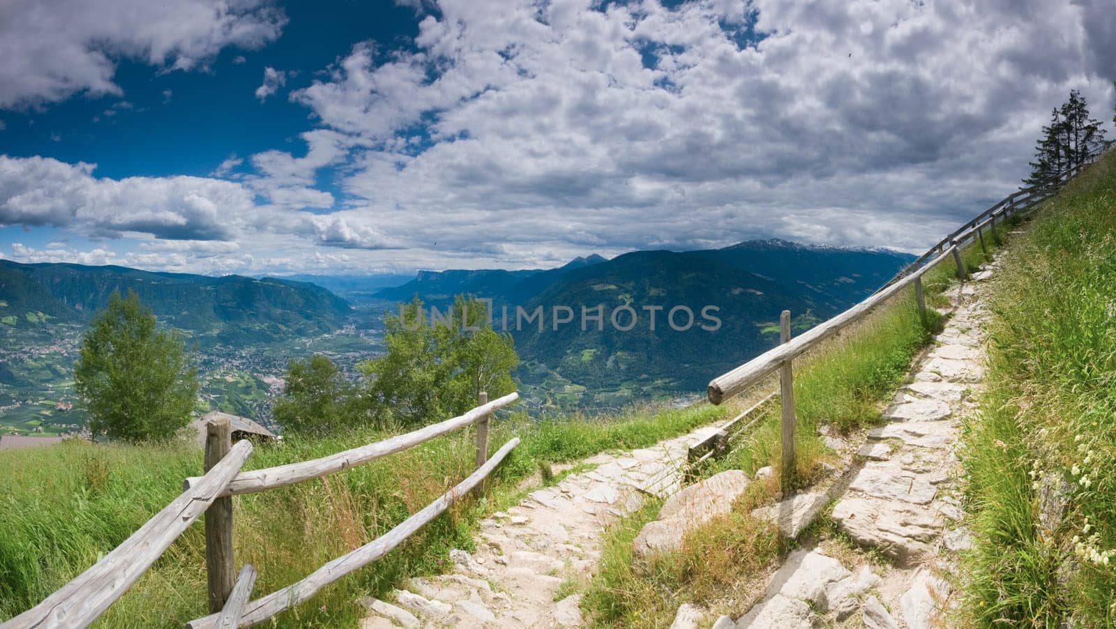 Panoramic view of the Merano Valley from the vantage point on the Merano high-altitude hiking trail between the Hochmuth cable car mountain station and the Talbauer mountain inn