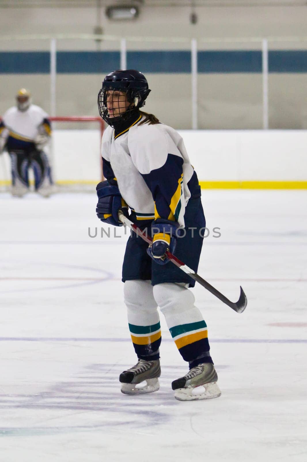 Female ice hockey player playing in a game