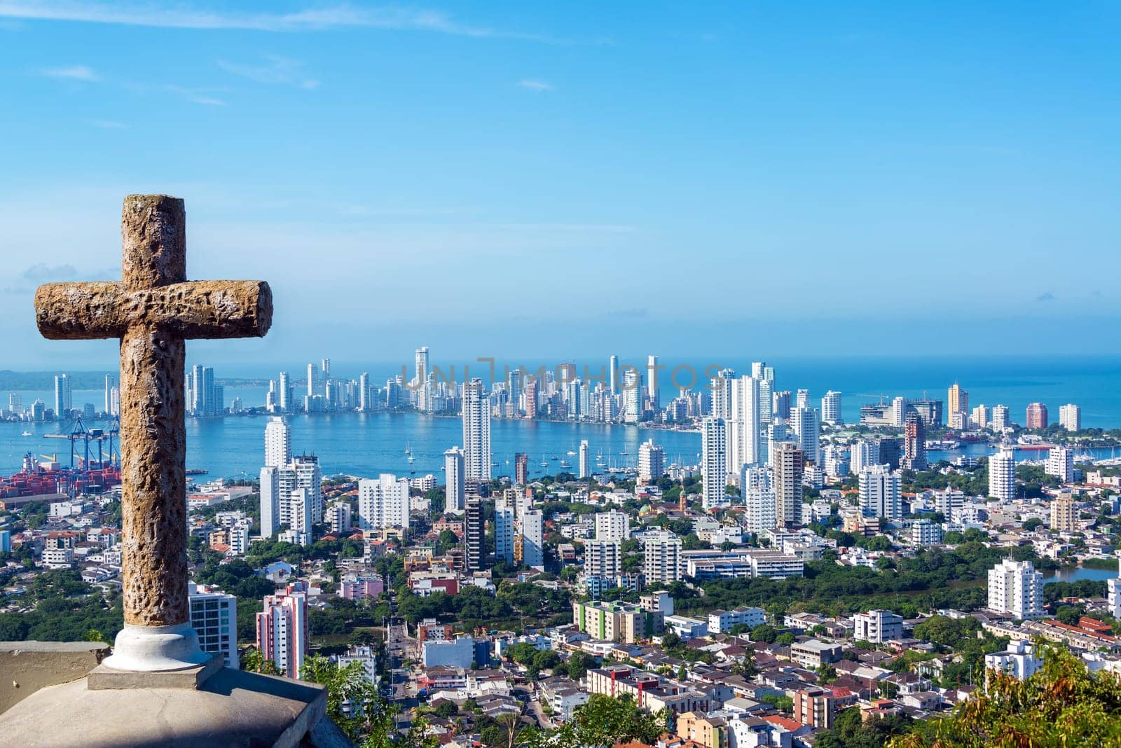 View of the modern part of Cartagena, Colombia with a stone cross in the foreground