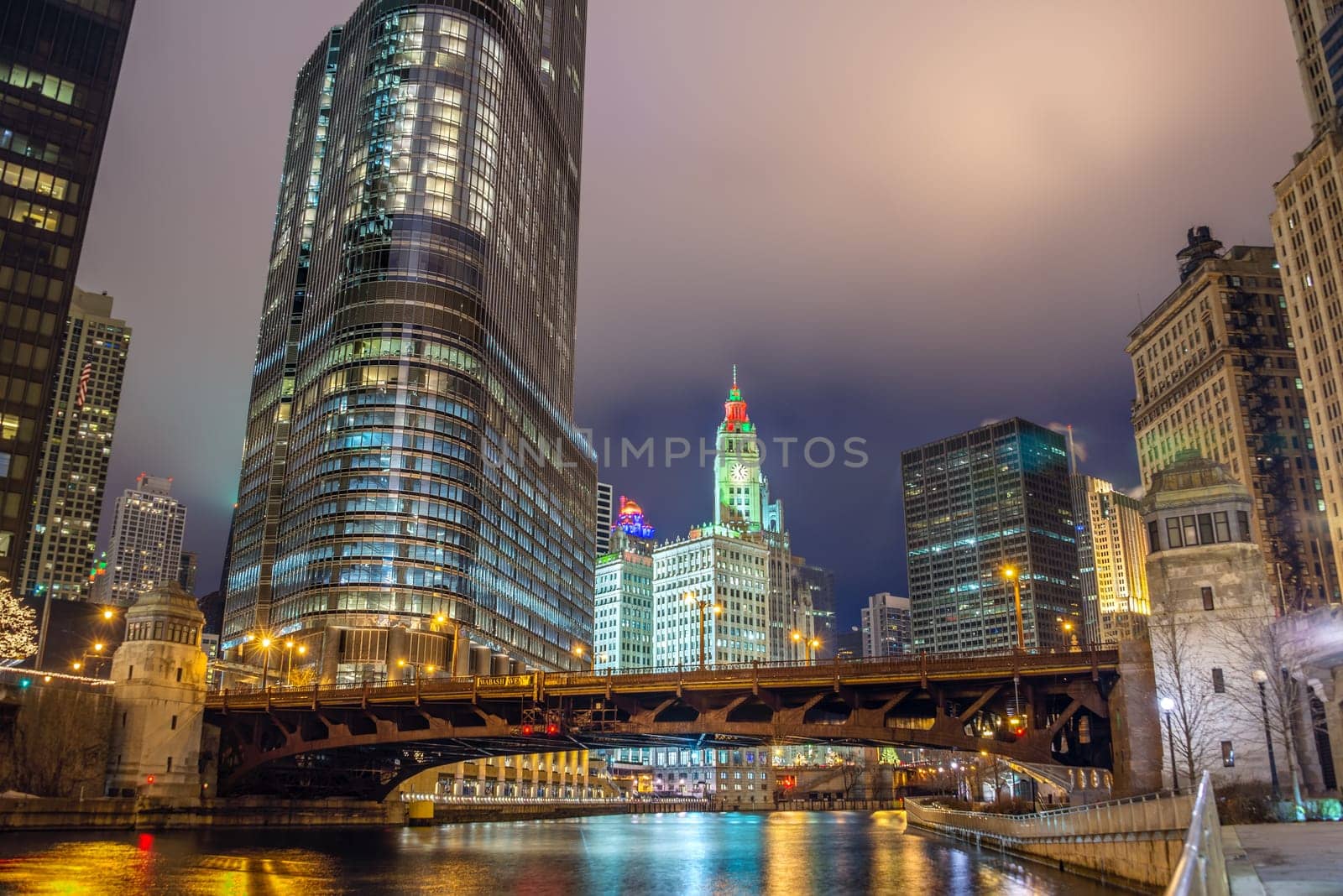 View of the Chicago River and skyscrapers in downtown Chicago as seen at night