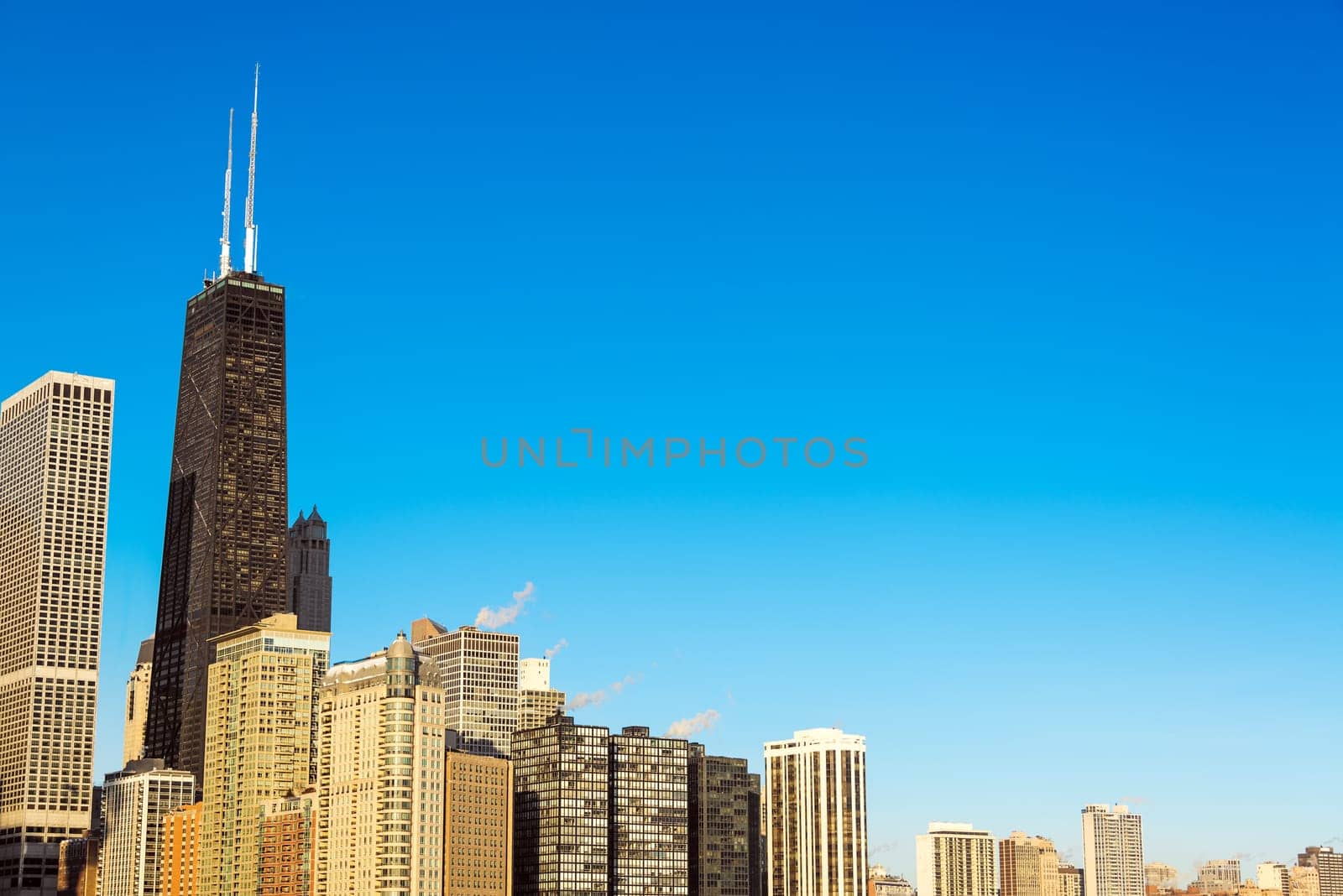 View of Skyscrapers in downtown Chicago with a beautiful blue sky