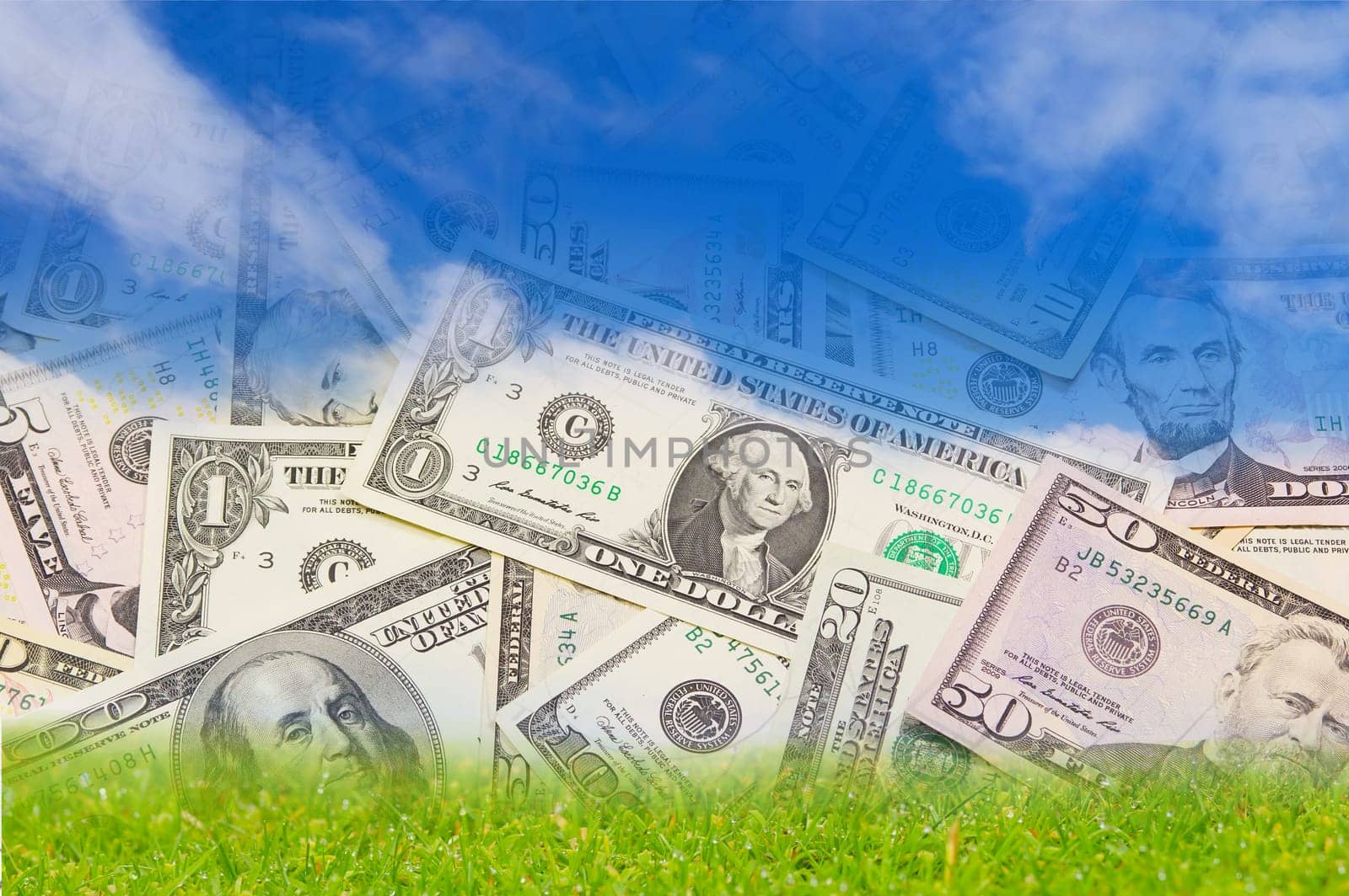Background with U.S. banknotes falling from the blue sky on the green land.