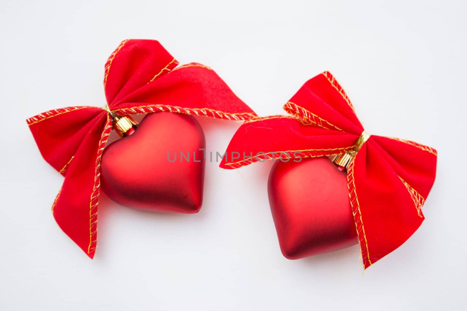 Heart shaped decoration with ribbons around it.