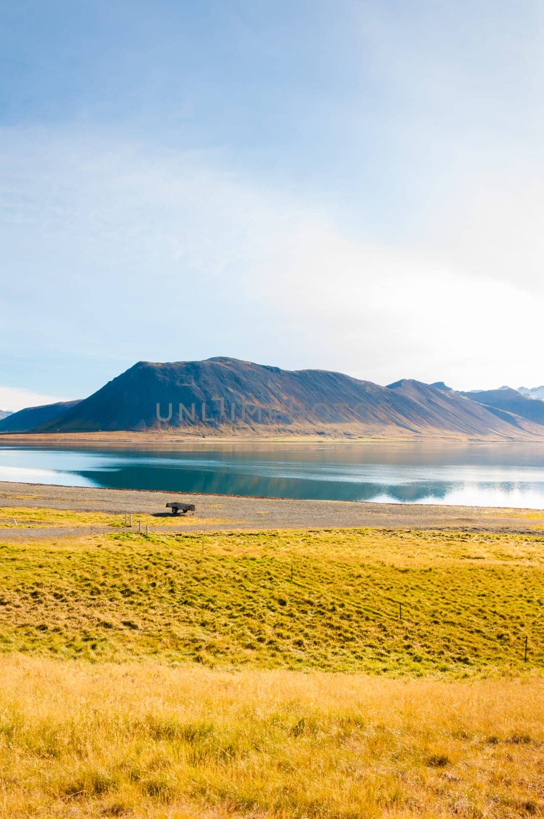 Icelandic landscape with volcanic rocks and green grass