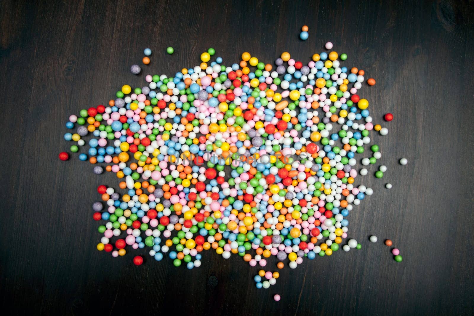 Color balls on wooden background