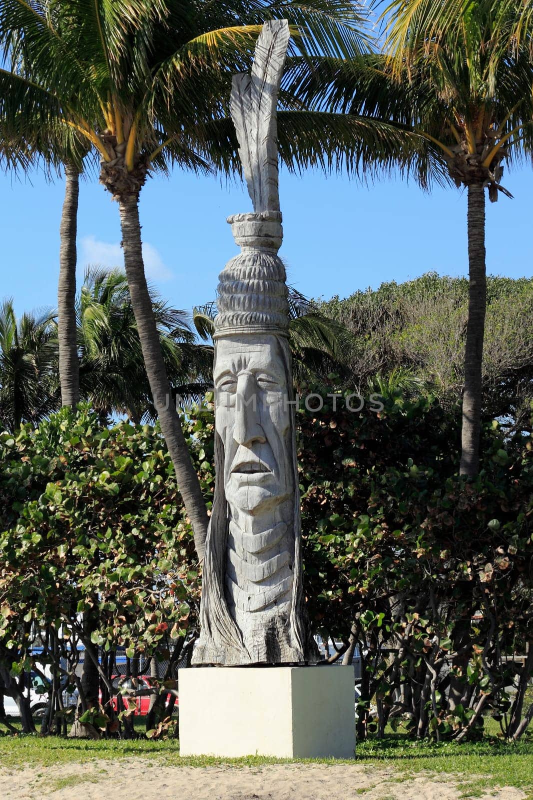 FORT LAUDERDALE, FLORIDA - FEBRUARY 5, 2013: American Indian Outdoor wooden art called Whispering Giant by artist Peter Wolf Toth seen along A1A across the street from the beach in DC Alexander Park.
