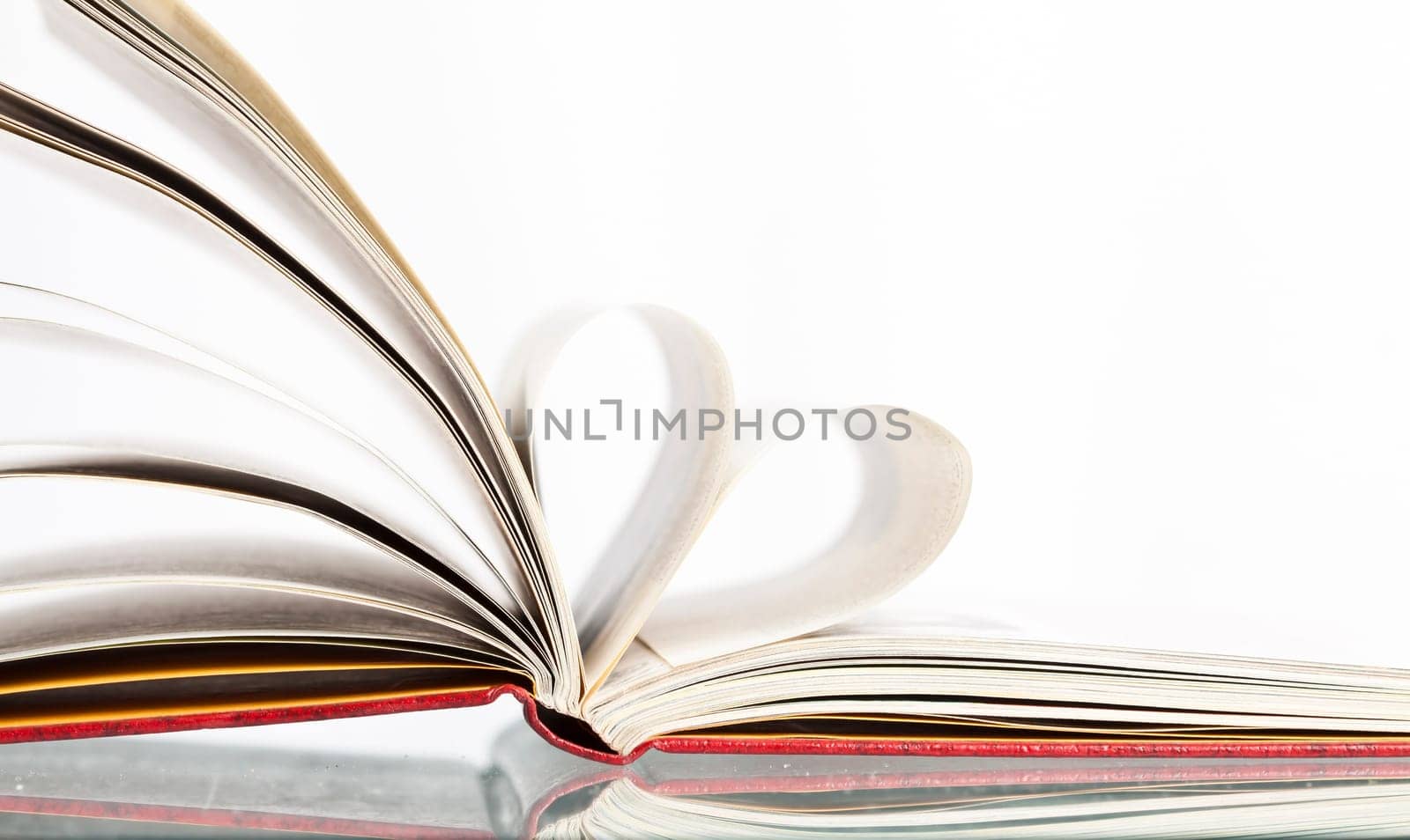 Close up on heart shaped book pages