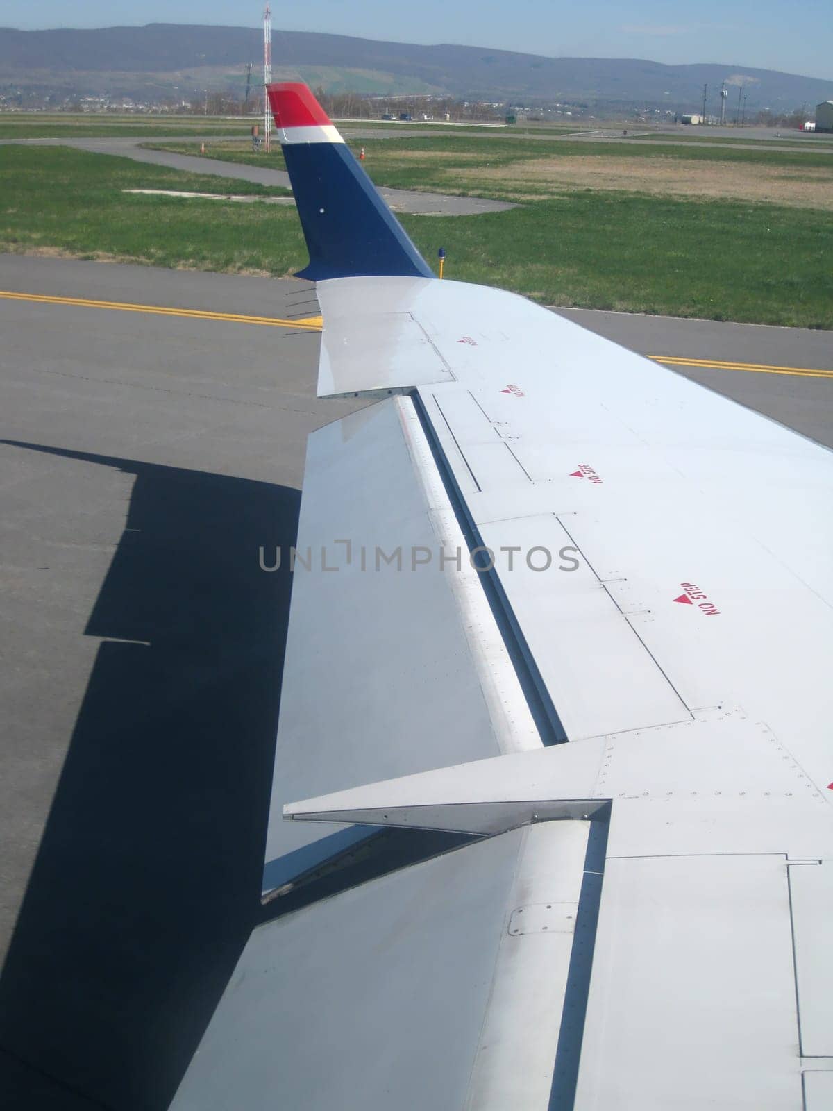 stock pictures of airplanes on the ground in an airport.