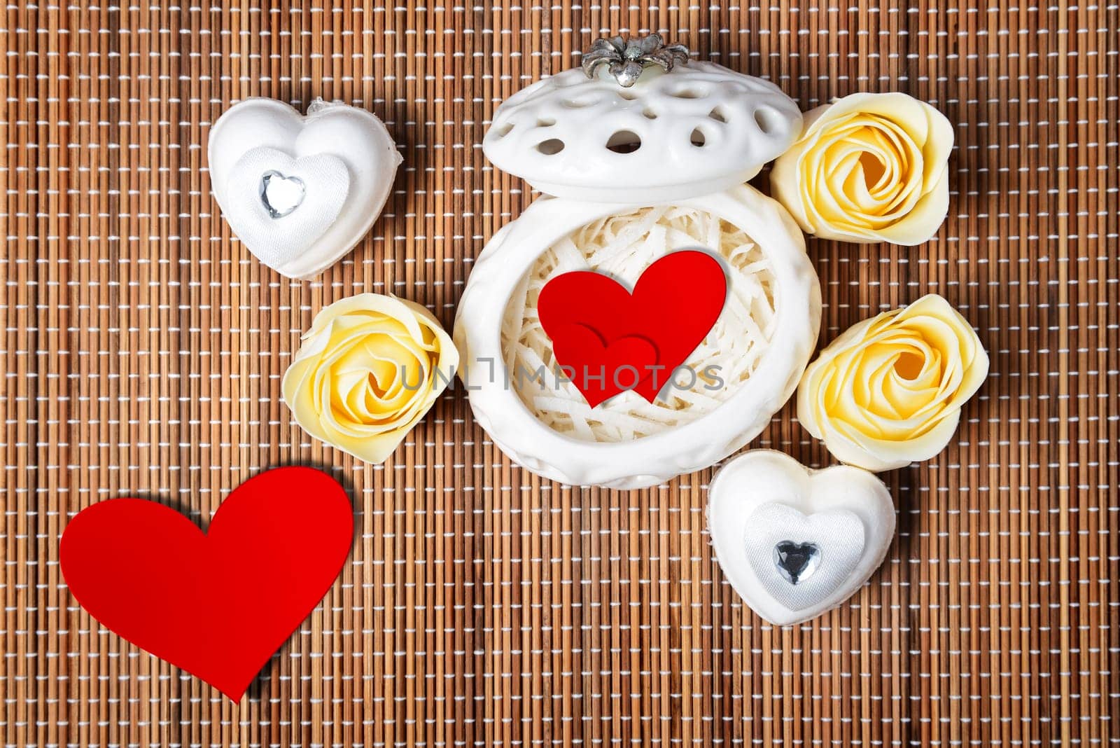 Still life of red hearts on a white casket. concept for valentines day