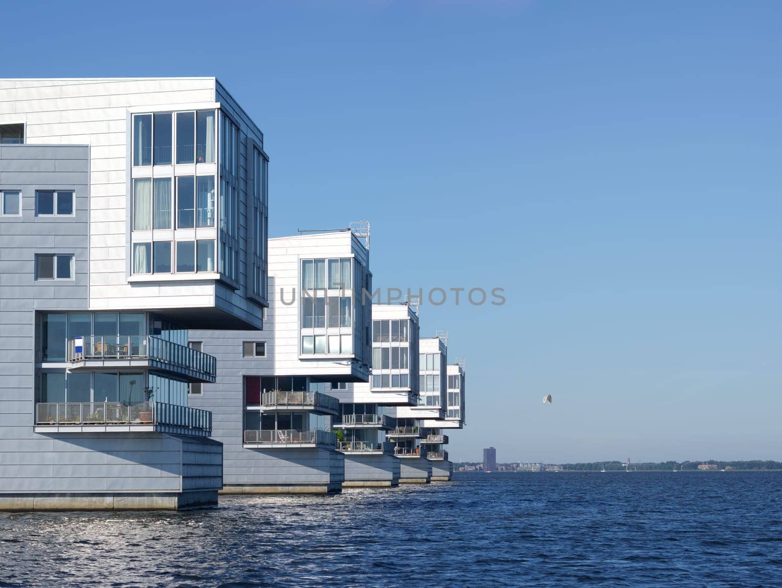 modern apartments at a lake shore in the netherlands