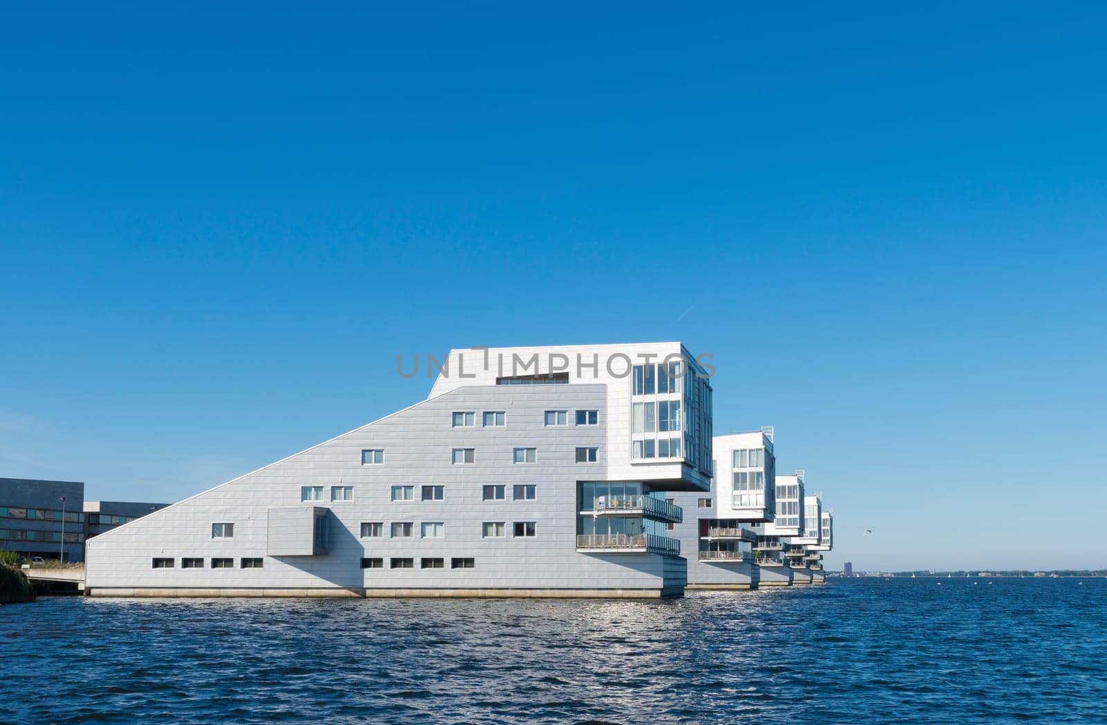 modern apartments at a lake shore in the netherlands