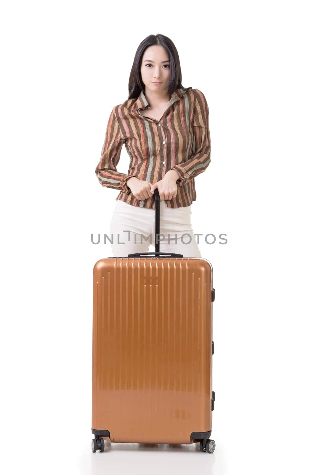 Modern Asian woman stand with a luggage, full length portrait on white background.