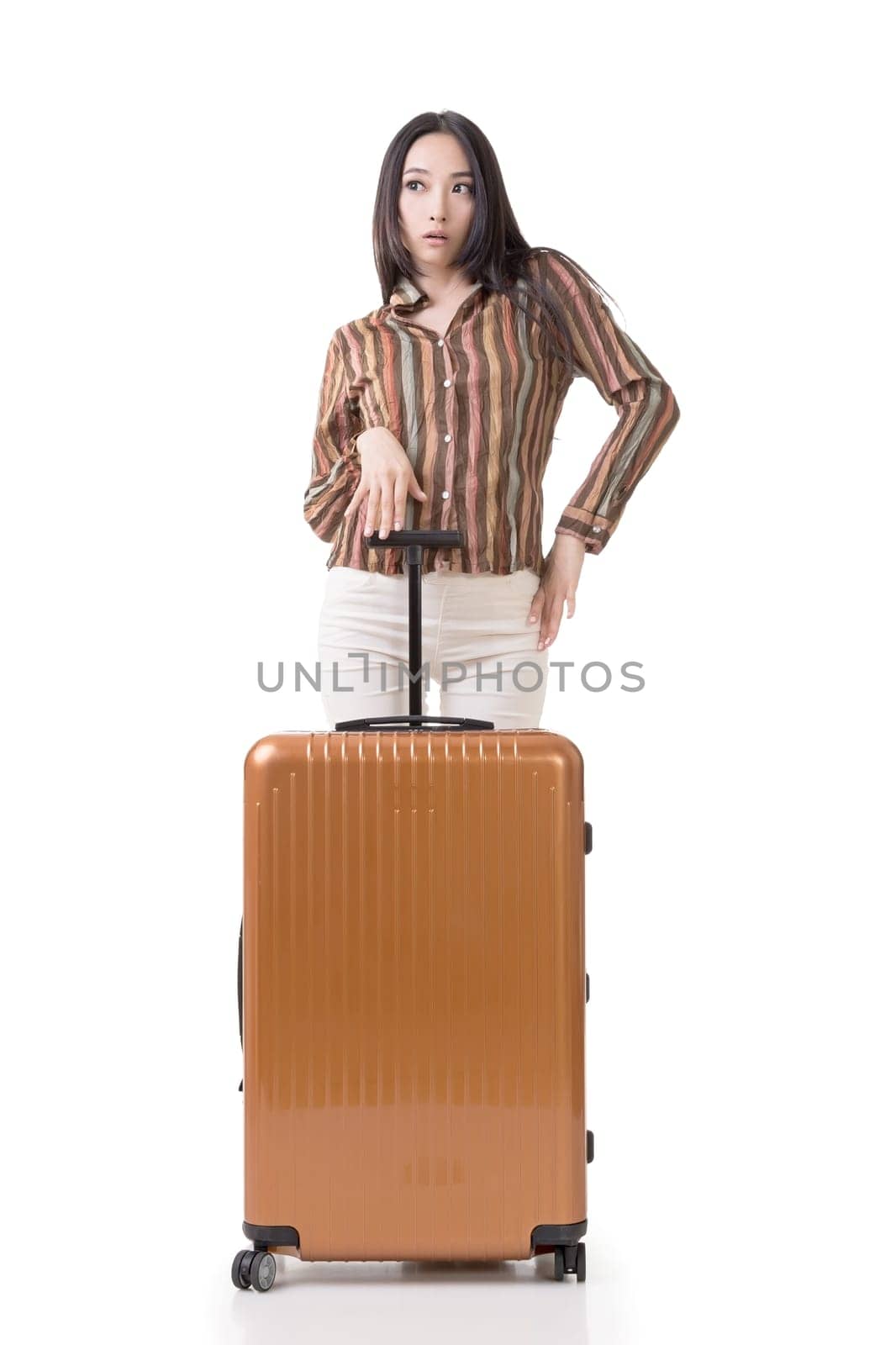 Modern Asian woman stand with a luggage, full length portrait on white background.