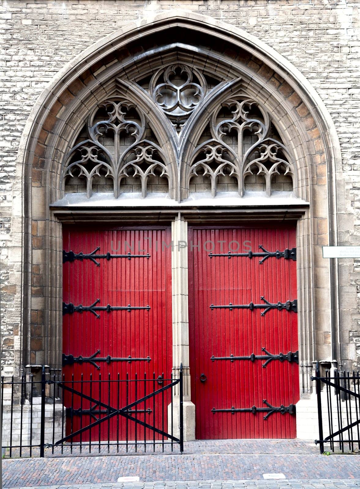 Red church door of the Zuiderkerk in Leiden, the Netherlands.