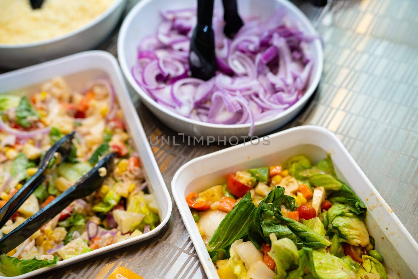 Salad bar. Salad buffet at restaurant. Fresh salad bar buffet for lunch. Healthy eating. Vegetable salad in bowl on counter. Vegetarian food. Vegetarian bowls at the counter. Fresh and healthy food. by Fahroni