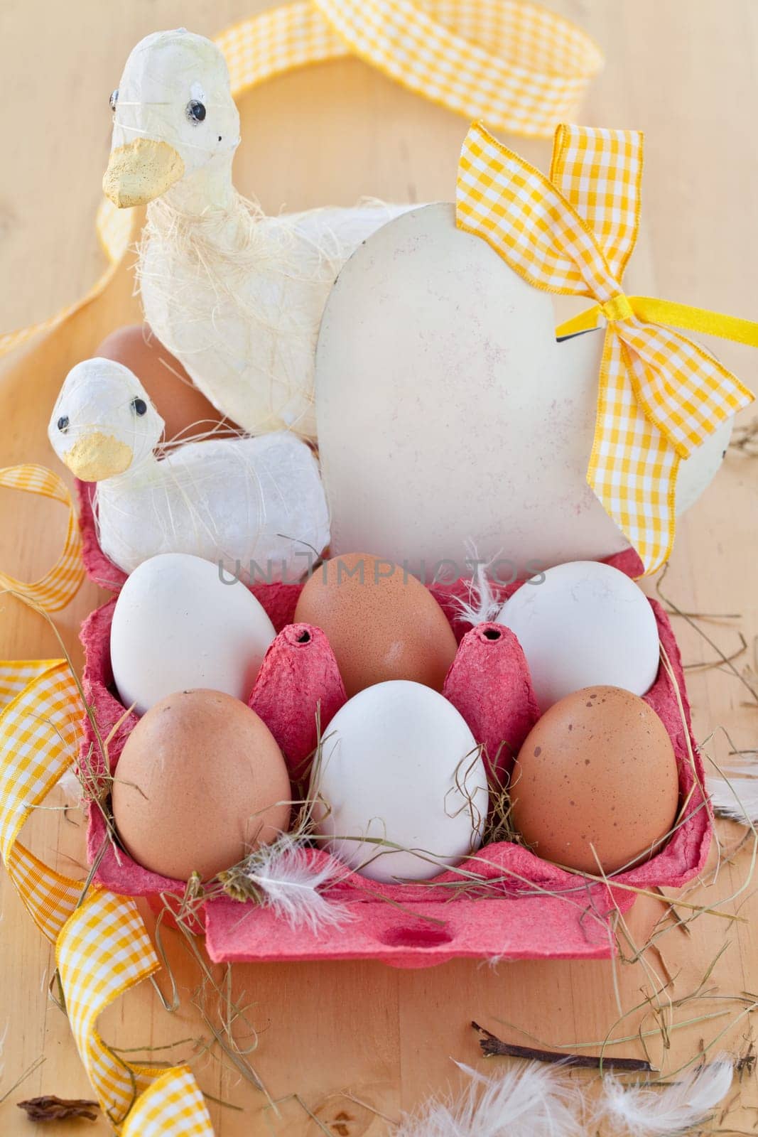 Red cardboard box with eggs and decorations for Easter